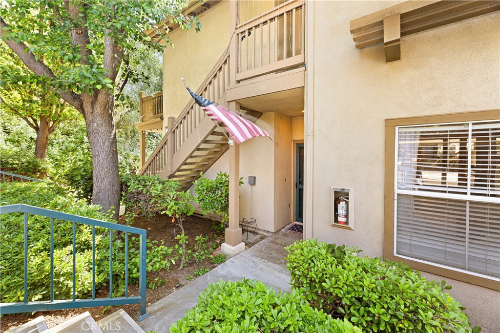 This beautiful home is ready to go. single-level, lower-unit one of the bigger floor plans offered, located in the highly desirable community of Los Portillos. This 2-bedroom, 2-bathroom home offers an open floor plan perfect for comfortable living. The spacious living room features a fireplace creating a warm and inviting space. Just Adjacent to the kitchen that has and upgraded top of the line wifi oven is a wonderfully sized dining area . You will love the spacious primary bedroom,an ensuite Shower, and a large vanity. On the opposite end is another inviting secondary bedroom and secondary bathroom. Conveniently located laundry in the closet and an attached 1 car garage with custom over head Safe racks professionally installed in garage and 1 carport which is very convenient located steps out the front door. You will love the Palm trees that compliment the community pool and spa. Enjoy the proximity to shopping, dining, and everything the beautiful city of Rancho Santa Margarita has to offer. This home is a member of the Samlarc association granting you access to multiple pools, tennis courts, pickle ball courts, beach club and so much more!