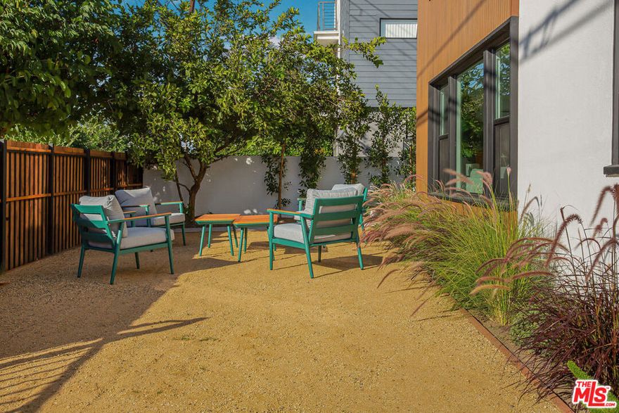 Mid City MCM  Modern Elegance Meets Classic Charm Adjacent to the Culver City Art District. Experience timeless design and effortless living in this captivating ground-floor two-bedroom residence nestled within an intimate four-unit Mid City TIC building. Thoughtfully updated while honoring its architectural roots, this home seamlessly blends classic charm with Mid-Century Modern sophistication. Inside, you'll find warmth, character, and style at every turn, highlighted by clean lines, abundant natural light, and refined craftsmanship throughout. Spacious rooms with 8-foot ceilings, beautiful flooring, and an open, airy floor plan create a comfortable and inviting living environment.  Modern design features include recessed LED lighting, dual-pane windows, and vibrant accent tones that enhance the Mid-Century aesthetic. The chef's kitchen is a true showpiece, boasting custom cabinetry, Fisher & Paykel refrigerator, Samsung 5-burner slide-in gas range, stainless steel dishwasher, OTR microwave, and a built-in laundry center.  Every system has been upgraded for peace of mind including a new electrical sub-panel and wiring, upgraded plumbing, ABS sewer line, and a 3-zone mini-split HVAC system for year-round comfort. The property also includes a private 1-car garage, automatic driveway gate, and secure gated entry. The exterior has been meticulously maintained with fresh paint, landscaped grounds, and a shared outdoor patio perfect for entertaining or relaxing al fresco. Additional conveniences include community storage closets in the garage and a shared storage room. Prime Location The Best of LA at Your Doorstep: Located in the heart of Mid City, just steps from West Adams and adjacent to the Culver City Arts District, this home offers unbeatable access to Century City, Beverly Hills, and the Westside. Enjoy the neighborhood's vibrant dining and cultural scene with favorites like Highly Likely Caf, Mizlala, Delicious Pizza, and Alta Adams, all just minutes away. With quick access to major freeways and Metro lines, commuting to LAX, Santa Monica, or Downtown LA is a breeze.  Mid City MCM  Modern Living. Timeless Design. Unbeatable Location.