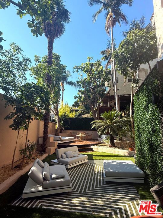 Designer Hollywood Heights Retreat with Private Entertaining Deck Furnished, 6-12 Month Lease in the historic enclave of Hollywood Heights, this fully furnished designer residence presents a rare opportunity to enjoy a boutique-style home with both architectural charm and contemporary luxury. Offering 1,400 square feet of interiors styled with custom finishes and designer furnishings, along with an additional 1,500 square feet of landscaped outdoor space shared only with the owner, the property delivers a perfect balance of privacy, comfort, and sophistication in one of LosAngeles's most desirable hillside neighborhoods. Inside, gallery-inspired design defines every detail. Grasscloth walls, custom cabinetry, layered textures, and curated artwork create an environment that is both welcoming and refined. The main suite is a serene retreat, while a flexible alcove easily converts into either a guest space or private office. A chef's kitchen equipped with double ovens, a gas cooktop, and brass accents makes cooking effortless, while the spa-style bath is finished with luxe contemporary tilework and LED mirrors, a Toto bidet toilet, turning daily routines into moments of indulgence. The true centerpiece of the home is its outdoor living space. A private backyard and expansive deck form a one-of-a-kind retreat with sculptural landscaping, premium Manutti daybeds, and programmable LED lighting that sets the stage for everything from relaxed mornings with coffee to lively evening gatherings. The seamless connection between indoor and outdoor spaces gives the home a resort-like quality rarely available in this historic neighborhood. Modern comfort enhances the design pedigree, including many smart Philips Hue lighting throughout, included utilities and high-speed internet, a Samsung high-end Washer-Dryer combo, and the option of biweekly cleaning for a hotel-grade living experience. Permit parking ensures convenience, while thoughtful details throughout the home elevate both function and style. Just minutes from Runyon Canyon, the Sunset Strip, and major studios, the residence is ideally suited for entertainment professionals, executives on assignment, or anyone seeking a stylish furnished home with both privacy and proximity to LA's cultural core. Hollywood Heights remains celebrated for its storied architecture and hillside charm, and this retreat builds on that tradition with a contemporary edge. Lease terms are furnished only, with six- to twelve-month options preferred, inclusive of utilities and internet, with a security deposit required and pets considered on approval. This is more than a rental is a boutique Hollywood Heights retreat that blends historic character, modern comforts, and a private resort-style setting into one complete furnished lifestyle.