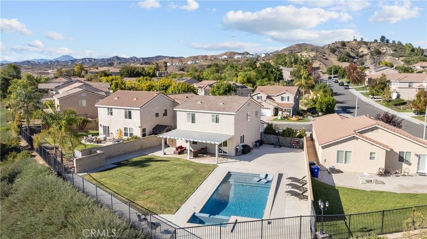 Welcome to your dream home in the desirable Hasley Hills community! This warm 2,247-square-foot residence on a 9,321-square-foot lot located in a cul-de-sac beautifully blends comfort and style. With 4 bedrooms and 2.5 bathrooms, the open-concept layout is perfect for gatherings and everyday living. A large front yard and covered porch create inviting curb appeal.
The updated kitchen features granite countertops, a stylish backsplash, stainless steel appliances, and a breakfast bar ideal for morning coffee or casual chats. Tile floors extend through the kitchen and dining room, while plush carpeting in the family room adds warmth, flowing into a cozy family room filled with natural light. Downstairs, a freshly painted powder room adds charm. The separate laundry room includes updated cabinetry, a backsplash, added shelving, and extra counter space for convenience.
Upstairs, the primary suite offers an ensuite bath with dual sinks and an updated walk-in closet. Two additional spacious bedrooms feature ceiling fans and mirrored closets, and a versatile fourth bedroom, currently utilized as a home office and theater room, includes a built-in desk, cabinets, shelving, and ample storage. Ceiling fans in all bedrooms and a full bathroom ensure comfort throughout.
The backyard is a true showstopper! The expansive lot boasts a stunning pool with a Baja shelf and spa, creating a resort-like oasis perfect for relaxing or entertaining. A covered patio provides the ideal spot to unwind while enjoying breathtaking valley views. The generous grass area invites play and recreation, while large concrete sections offer space for sports or outdoor gatherings, making this backyard an unforgettable retreat.
Modern upgrades, including a new AC unit, whole-house water filtration system, and updated water heater, ensure efficiency. The two-car garage offers ample storage. Located in Hasley Hills with no Mello-Roos and low HOA fees, this home is just minutes from the 5 and 126 freeways, Castaic Lake, and Six Flags Magic Mountain. Nearby grocery stores, restaurants, and parks add convenience. This is the perfect place to create lasting memories. Schedule your private tour today!