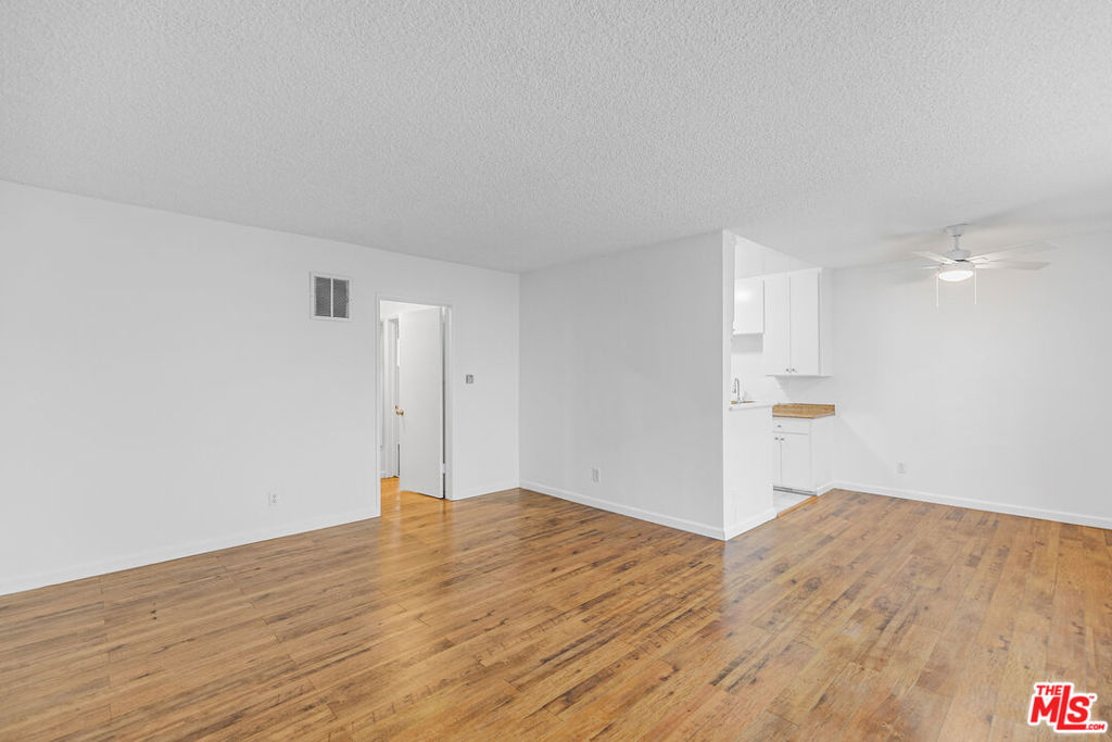 Welcome to 1812 N Gramercy Place, a sunny 2BR/2BA that gives you space to stretch out and breathe right in the middle of Hollywood.The living and dining area is bright and open, lined with wood-style floors and wide windows that let the light pour in. The galley kitchen keeps it classic with a gas stove, fridge, plenty of cabinet space, and that cozy breakfast nook vibe. Each bedroom has its own personality with mirrored closets and ceiling fans, while the bathrooms bring a little vintage splash yes, that's a turquoise tub waiting to be your retro moment.The building keeps life simple with a tandem parking spot included and paid community laundry on site. Step outside and you're tucked into a quiet pocket street that still puts you right between Hollywood and Los Feliz. That means you're minutes from brunch at Square One, catching an indie at the Los Feliz 3, Thai Town eats, Griffith Park hikes, and easy Red Line access when you don't feel like driving.It's spacious, central, and a little retro in all the right ways.