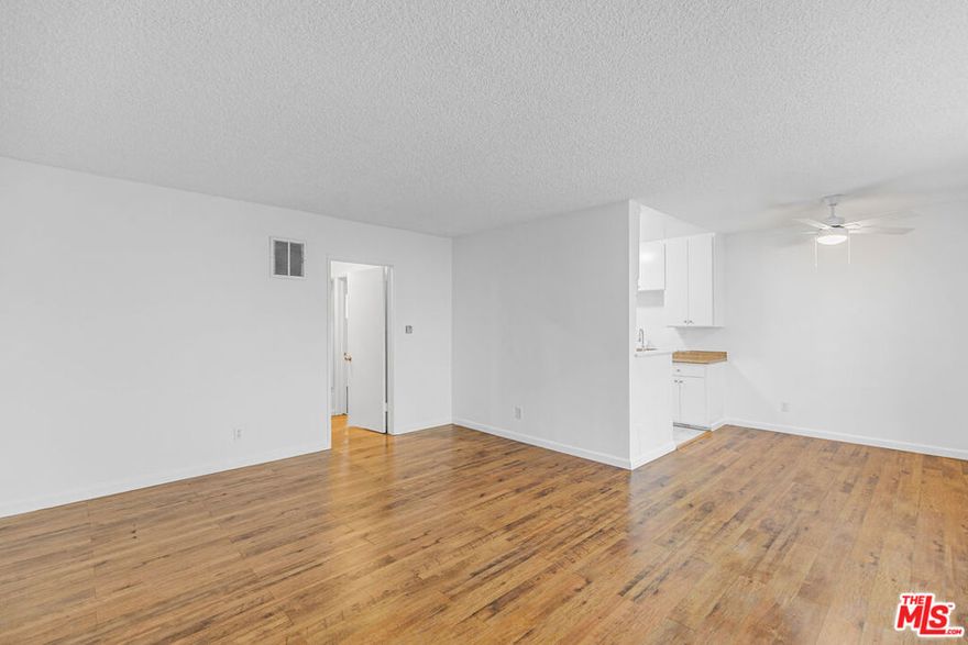 Welcome to 1812 N Gramercy Place, a sunny 2BR/2BA that gives you space to stretch out and breathe right in the middle of Hollywood.The living and dining area is bright and open, lined with wood-style floors and wide windows that let the light pour in. The galley kitchen keeps it classic with a gas stove, fridge, plenty of cabinet space, and that cozy breakfast nook vibe. Each bedroom has its own personality with mirrored closets and ceiling fans, while the bathrooms bring a little vintage splash yes, that's a turquoise tub waiting to be your retro moment.The building keeps life simple with a tandem parking spot included and paid community laundry on site. Step outside and you're tucked into a quiet pocket street that still puts you right between Hollywood and Los Feliz. That means you're minutes from brunch at Square One, catching an indie at the Los Feliz 3, Thai Town eats, Griffith Park hikes, and easy Red Line access when you don't feel like driving.It's spacious, central, and a little retro in all the right ways.