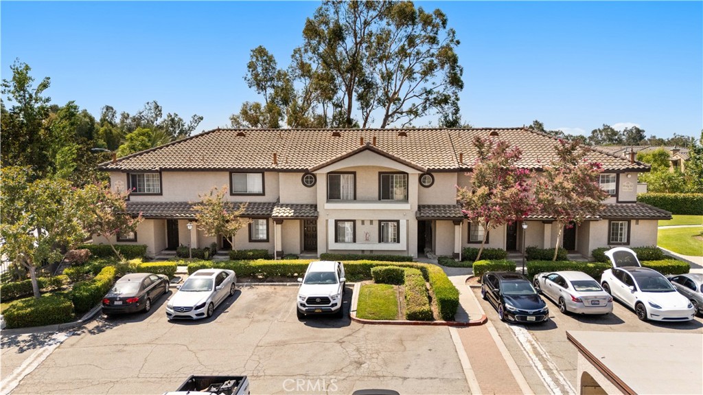 Sharp END UNIT in gated community, next to greenbelt and near pool/spa and tennis courts. Great floor plan has formal living room with fireplace, formal dining area, open kitchen has granite counters, BOTH BEDROOMS ARE ON THE SECOND FLOOR. Private fenced rear patio facing greenbelt. 1 car detached garage. Close and convenient to Victoria Gardens and Freeways.