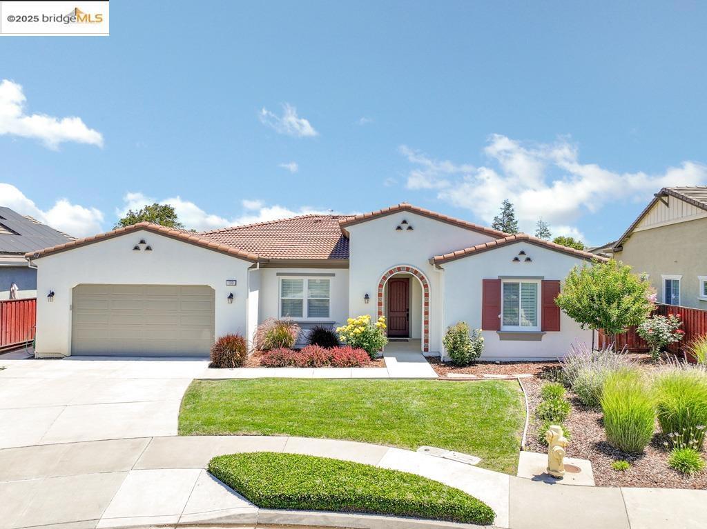 Better than new & beautifully upgraded throughout! This stunning single-story 4 bed / 3.5 bath home offers 3,125 sq ft of exceptional living space on an 11,086 sq ft premium lakefront lot in Oakley’s highly desirable Summer Lake community. Step inside to wide-plank hardwood floors, soaring ceilings, & an open-concept layout filled with natural light. The chef’s kitchen features a quartz island, granite countertops, stainless steel appliances, and rich espresso cabinetry—flowing seamlessly into a spacious great room, perfect for entertaining. Enjoy indoor-outdoor living year-round in the covered California room with peaceful lake views. Just steps from your backyard, enjoy your own private dock—perfect for launching a kayak or paddleboard and soaking in the beauty of the 25-acre lake. The expansive primary suite offers room for a sitting area or workout space, tranquil water views, a generous walk-in closet, and a spa-like bath with soaking tub, separate shower, and dual vanities. Additional highlights include a junior suite plus a flex room with French doors—ideal as an office, den, or optional 5th bedroom. Resort-style community amenities include a 75-ft pool, clubhouse, tennis courts, sports fields, parks, & scenic trails. Lakeside luxury with unbeatable space, and style!