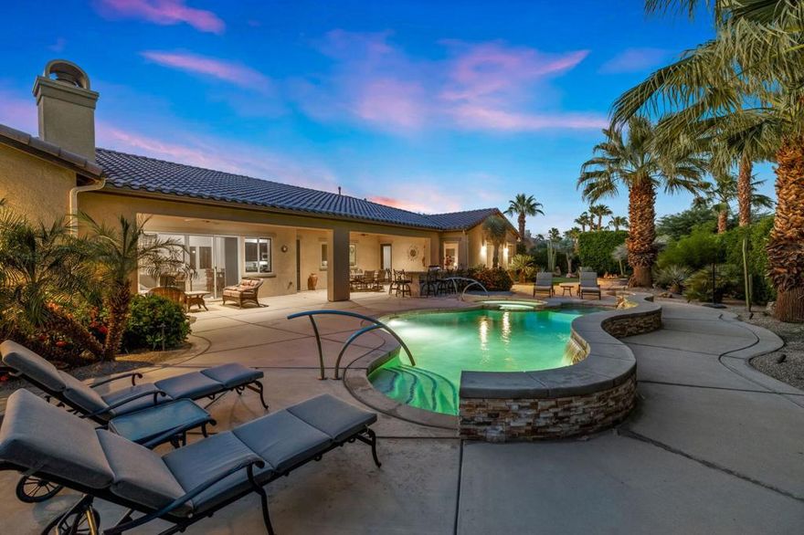 Luxury Redefined in Prestigious Madison Estates.Step into elegance with this immaculate 4-bedroom, 4.5-bath residence, offering 4,588 sq. ft. of thoughtfully designed living space on an expansive 22,215 sq. ft. lot.  A rare find, this original-owner home has been meticulously maintained, blending modern finishes with timeless sophistication.Inside, a bright open-concept layout awaits.  A versatile den/office (or 5th bedroom) provides a serene retreat for work or leisure, while the spacious living room-complete with a custom built-in entertainment center-flows seamlessly into the dining area.  Sliding glass doors open wide, creating a breathtaking indoor/outdoor living experience to the covered loggia complete with a gas fireplace. At the heart of the home is a chef-inspired gourmet kitchen, featuring a top-tier appliances, dual ovens and an oversized center island perfect for entertaining.The luxurious primary suite is a private haven, showcasing a spa-like ensuite with a soaking tub, expansive glass-enclosed shower, dual vanities, and oversized walk-in closets.  Three additional large bedrooms, each feature their own ensuite bath and walk-in closets, offering comfort and privacy for the entire family and guests.Outdoors, your private resort oasis unfolds across a half-acre lot.  Enjoy a sparkling salt water pool and spa, cozy firepit, and a covered patio with a full outdoor BBQ island, misting system, TV, and elegant landscape lighting.  A lush synthetic grass putting green with multiple holes keep your golf game in shape and guests entertained.  Also an epoxy-finished 3 car garage with A/C further elevate this remarkable property.Perfectly positioned on a quiet interior lot, you'll enjoy peace and privacy while being just minutes from world-class shopping, dining, golf, the Empire Polo Club, and the Indian Wells Tennis Garden. This is more than a home--its a lifestyle of comfort and luxury.Easy to show, just call Joe 760 275-8800
