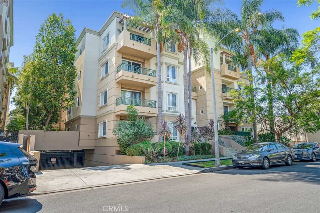 Polished, private, and perfectly located in the heart of Beverly Grove, this expansive 2-bedroom, 2-bathroom condominium offers 1,426 square feet of refined living in one of Los Angeles’ most desirable and walkable neighborhoods.
Thoughtfully designed and impeccably maintained, the home features rich wood flooring throughout, high ceilings, and a seamless open-concept layout anchored by a modern fireplace. The kitchen is built to impress with granite countertops, stainless steel appliances, and generous cabinetry—ideal for hosting or unwinding in style.
Exceptionally quiet, the residence shares only one common wall, discreetly located behind the kitchen, enhancing the feeling of privacy throughout the space. The second bedroom, perfectly positioned away from the main living area, offers flexibility for use as a creative studio, wellness space, or guest room. The primary suite is a calm retreat, with large walk-in closet and a well-appointed en suite bath.
From the main living space, enjoy direct access to a serene, courtyard-facing patio —an ideal extension of the home for morning coffee or a glass of wine at dusk.
Additional features include in-unit laundry, two secured parking spaces in the gated underground garage, and monthly HOA dues of $525, which include water, trash and common area maintenance.
Step outside and discover the best of Beverly Grove and its surrounding hot spots. You are moments from The Grove, Erewhon, the Beverly Center, 3rd Street boutiques, and the coveted shops, cafés, design houses lining Robertson Boulevard and within a mile or so of Beverly Hills. World-class dining, wellness studios, and cultural landmarks are all within reach. The property is also located just blocks from one of the city’s premier medical centers, Cedars Sinai Medical Center, adding even more convenience to this unbeatable address.
This is a rare opportunity to own a spacious, sophisticated home with exceptional access, flexibility, and lifestyle—all in one of LA’s most vibrant zip codes.