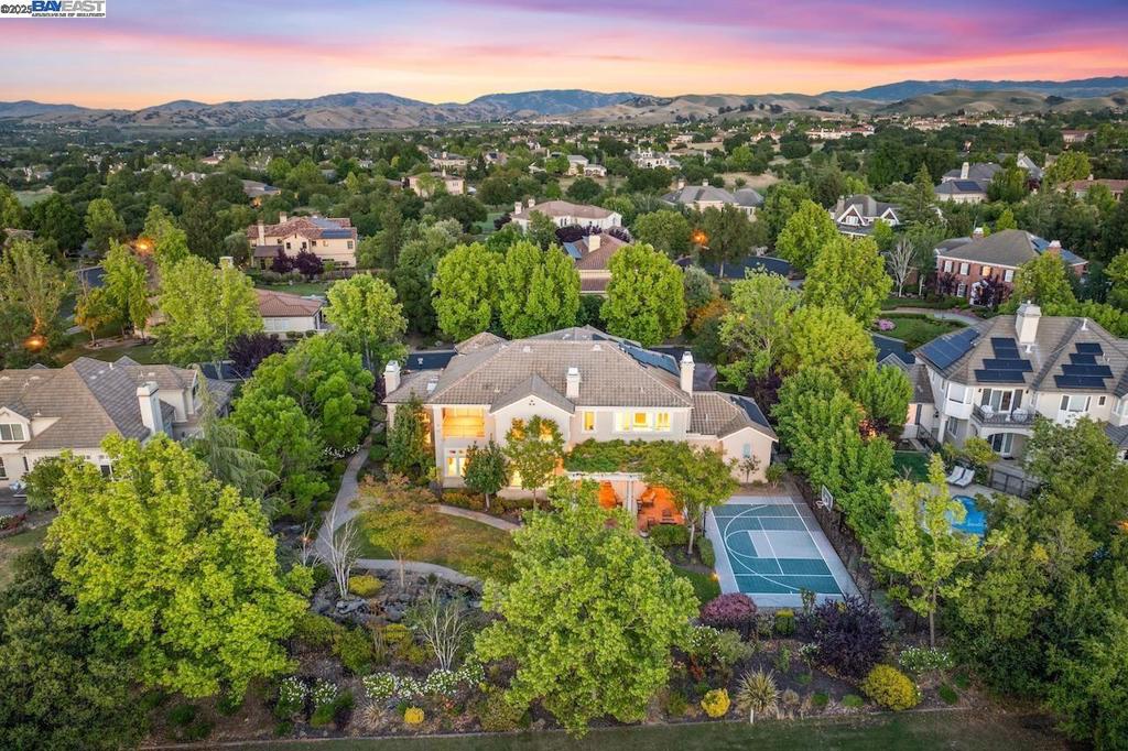 Welcome to 1751 Spumante Place, a stunning custom estate located in the GATED and prestigious Ruby Hill community in Pleasanton. Situated directly on the golf course with sweeping fairway views, this home offers 5 bedrooms, 4.5 bathrooms, and 5,596 square feet of beautifully designed living space. The home is primarily EAST-FACING. Recently updated with brand new carpet throughout and fresh interior paint, the home is move-in ready. The spacious kitchen features a center island and abundant cabinetry, perfect for entertaining. Additional highlights include a loft bonus space, a downstairs office, a downstairs bedroom suite, and a large laundry room. The luxurious primary suite features two(2) walk-in closets, a spa-inspired bathroom, and a private deck with golf course and Mt. Diablo views. Step outside to a serene backyard with professional landscaping and a koi pond. Energy efficiency is enhanced by fully owned solar panels. Other features include a four-car garage, a cul-de-sac location, and access to Ruby Hill’s exclusive amenities, including a clubhouse, tennis courts, and 24-hour security. This exceptional property offers the perfect blend of luxury and lifestyle in one of Pleasanton’s most sought-after communities.