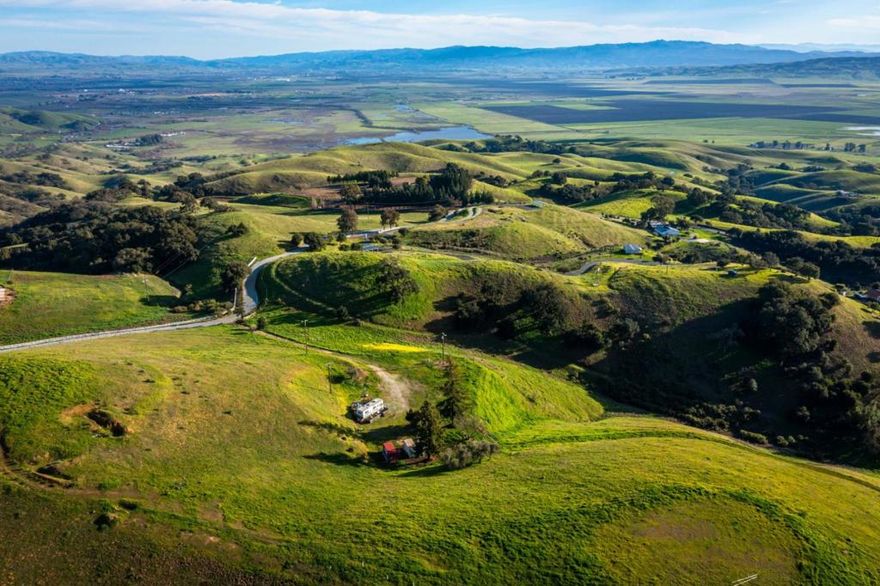 Build Your Dream Home! Nestled among million-dollar estates, this breathtaking 5-acre parcel offers endless possibilities for your vision and creativity. Please note: The homes depicted in the pictures are for illustration purposes only, no homes are currently built on the property. Perched on a scenic hillside, this vibrant land boasts stunning city-light views while providing a serene retreat surrounded by nature. With ample space for horses, agriculture, and more, this property is perfect for those seeking tranquility without sacrificing convenience. Located just 10 minutes from the Gilroy Outlets, you'll enjoy easy access to shopping, dining, and major commute routes. The property is situated on a paved, city-maintained road and comes with building site approval, a fully functioning well, and power already on-sitea rare find with exceptional potential! Opportunities abound, whether you envision building a custom estate, an ADU (Accessory Dwelling Unit), a Junior ADU, a barn, or other structures.