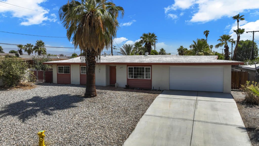 Darling and affordable home fit for a king at this price!!! HUGE back yard, and lots of open space. From the stunning view of the sunsets from the front windows to the sparkling pool right outside the back gate, this mid century modern home is all about original style. Enjoy the premium location on an elevated lot in a cul-de-sac with only 3 neighbors! New electrical panel, newer gas range, newer stove. This home boasts a brand new heat and air conditioner within the last 6 months. The new recently installed mini split really keeps the home extra cool in the summers with low power bills! Oversized 2 car garage with large storage capacity. Close proximity to Palm Desert Soccer Field and central Palm Desert.