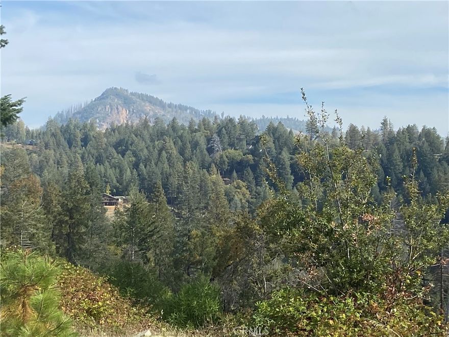 Views! Views! Views!  
Discover the perfect location in Paradise Pines with breathtaking views of the mountains and Sawmill Peak. This desirable parcel is nestled within the Paradise Pines Owners Association, offering access to a range of amenities including a swimming pool, clubhouse, tennis courts, and more.
Enjoy the serenity of nature while being close to outdoor adventures—ideal for mountain biking, off-road recreation, and exploring the scenic Feather River Canyon. Whether you're looking to build a peaceful retreat or an active lifestyle haven, this property offers the best of both worlds.
