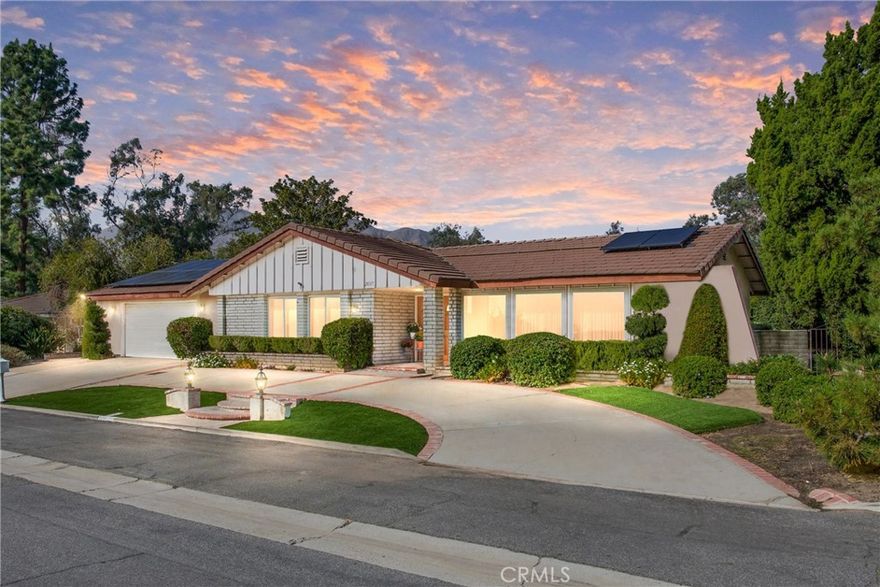 Opportunity Awaits! First time on the market in over 30 years, this well cared-for single-level home is ready to welcome its next chapter. Offering over 2000 sq. ft. of living space with 4 bedrooms, and 2 bathrooms, this rare property offers sweeping valley and mountain views from both front and back of the home.  Step through the double-door entry into the formal living room, where a wall of windows overlook the valley below. The space flows seamlessly into the dining room, making it ideal for gatherings with views of the backyard and local mountain range. The kitchen, with its durable counters, double ovens, electric cooktop, and microwave, is both functional and inviting. A quaint breakfast nook, built-in desk, and ample storage make it both functional and efficient  The spacious family room offers a more casual retreat with a cozy fireplace and sliders that open to the covered patio, the perfect spot to take in the mountain views. The private primary suite, located away from the other bedrooms, includes a walk-in closet and bath with a walk-in shower and dual sink areas. Three additional bedrooms share a full bath, offering plenty of room for family, guests, or a home office.  Additional highlights include: Indoor laundry,  direct garage access, newer solar panels (installed 2021) for energy savings, Low-maintenance front yard with turf, beautiful backyard with mature landscaping, concrete walkways, and a storage shed. This home offers a rare combination of space, views, and simplified living—all in a well-established neighborhood. Don’t miss this opportunity to make it yours!