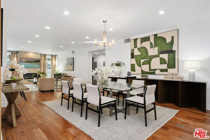 Welcome to La Terrasse, a refined contemporary luxury residence in the city of Beverly Hills, newly refreshed and professionally staged to reflect today's elevated, design-forward lifestyle. This sophisticated single-level condominium offers approximately 1,942 square feet of gracious living with two bedroom suites and 2.5 baths, blending timeless architecture with modern comfort and effortless flow. From the moment you enter, the residence feels expansive and serene. Warm brushed walnut hardwood floors, limestone accents, and clean architectural lines set a calm, gallery-like backdrop for the newly curated interiors. The open dining and living areas are designed for both everyday living and elegant entertaining, anchored by a dramatic limestone fireplace and framed by generous windows that fill the space with natural light.The open-concept layout flows seamlessly into the gourmet kitchen, featuring sleek Italian cabinetry, Viking stainless steel appliances, stone countertops, and a generous breakfast bar ideal for casual dining or hosting guests. An adjacent breakfast room or flex space works beautifully as a junior dining area, home office, or creative studio, perfectly aligned with today's work-from-home lifestyle. The primary bedroom suite is a true retreat, thoughtfully emphasizing comfort and scale. It offers direct access to the private terrace, and three custom walk-in closets, and a spa-inspired bath with dual marble vanities, soaking tub, and glass-enclosed shower. The guest suite is equally inviting and versatile, ideal for visitors, a den, nursery or a office. Residents of La Terrasse enjoy a collection of luxury amenities including a screening and lounge room with kitchen for events or parties, fitness center, conference space, sun deck, concierge form 7 AM to 12 AM, controlled access, secure subterranean parking with three parking spaces,  & ample guest parking, and private storage. Built in 2009, this boutique building of only 20 residences is known for its privacy, understated elegance, and exceptional location. Ideally situated between Santa Monica Boulevard and Beverly Boulevard, La Terrasse places you moments from Rodeo Drive, Robertson Boulevard, world-class dining, luxury shopping, and West Hollywood nightlife, while maintaining a discreet residential feel. Freshly restaged and move-in ready, this residence offers a rare opportunity to experience modern Beverly Hills living at its finest  sophisticated, comfortable, and impeccably presented for today's buyer.