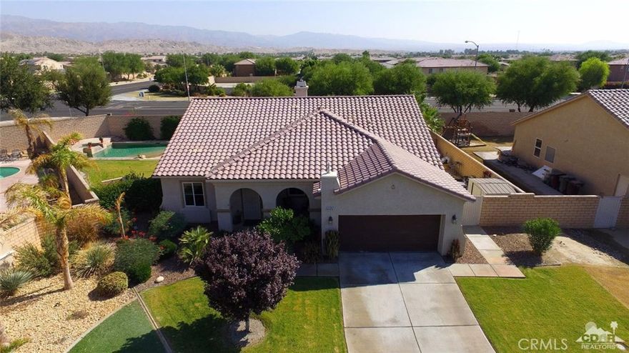 Foxstone Beauty! This is a rare one! Offering just under 2,200 sq. ft., 3 bedrooms PLUS den (or optional 4th bedroom!), 2 bathrooms, formal living room, formal dining room, and cozy family room off the kitchen with stone fireplace, this home is sure not to disappoint. This tastefully updated home offers open kitchen island with bar seating, upgraded counters and back splash, wonderful master suite with mosaic tiled shower and bath, custom wall accents, crown molding, ceiling fans throughout, and more. The house sits on an oversized custom lot that features a large salt system pool with beach entry, elevated spa and deck, outdoor shower, pavers, exterior gas fire pit, dog run, citrus trees with no neighbors behind you. Homeowners of Foxstone enjoy a greenbelt walking path and two privacy gates with low HOAs.