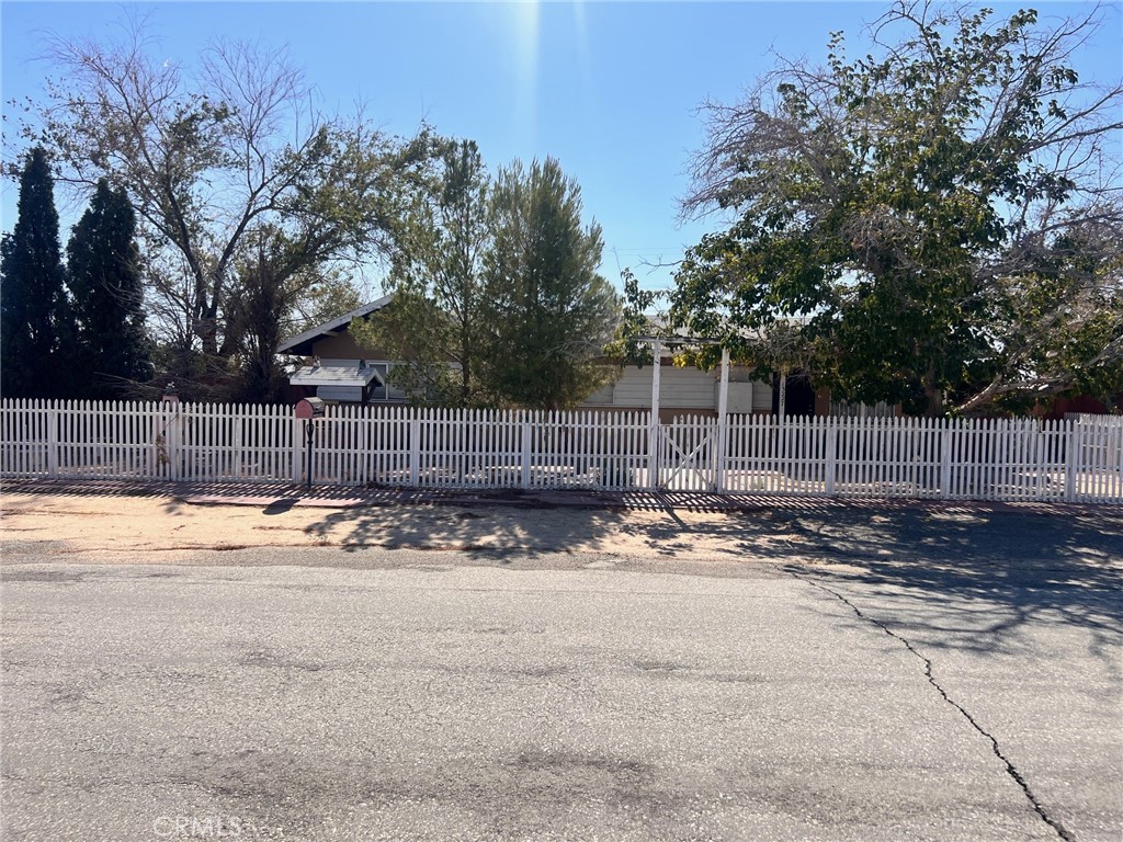 Investment opportunity, this property needs work but has many features. The main home has 4 bedrooms and 1 bathroom. This purchase includes 2 other adjacent parcels, APN# 233-301-04 & 233-301-01. The property also has 2 garages, a large laundry room, a closed patio multiple storage sheds and much more.