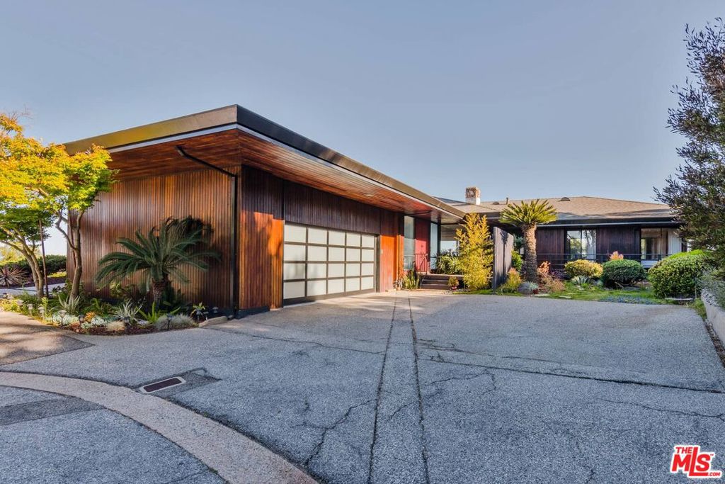 One of a kind private and gated estate perched above the hills of Palos Verdes with breath taking unobstructed views of Pacific Ocean, Catalina Island, San Pedro harbor, city lights and mountains. This extraordinary single level home sitting on more than an acre of land offers open floor plan with 3 bedrooms, a bonus room and 3 bathrooms. Kitchen opens to dining area, large family room, with a cozy fireplace adjacent to the living room and a large wet bar making it a spacious great room, all looking out to the incredible views through large full height glass doors and windows. Remodeled kitchen and baths showcase top of the line appliances, designer tiles and fixtures. Large decks and turf backyard compliment the space for large gatherings. Oversized two car garage and circular driveway offer plenty of parking. This sophisticated and inviting compound is the ideal place to call home close enough to everything, but far enough to relax in absolute privacy and serenity. Must see!