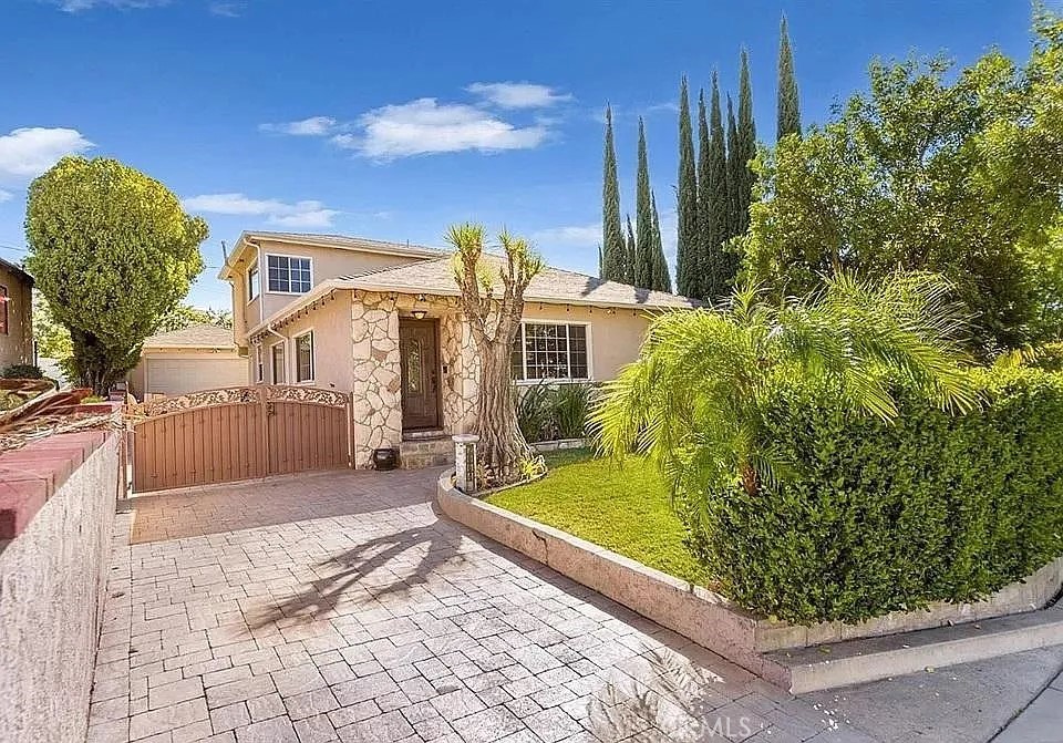 Stunning two-story home in Burbank featuring 5 Bedrooms, 3 Bathrooms, 2,002 square feet and on a 5,675-lot size. The property features Large and Bright living room. Kitchen with abundance of closet space, stainless steel appliances and a breakfast area. 3 Bedrooms and 2 Bathrooms downstairs and 2 Bedrooms and 1 Bathroom upstairs. Backyard features: low maintenance, large covered sitting area, very private, 2-car detached garage and gated. Additional features: separate laundry room with sink (downstairs), coat closet, linens closet, hardwood flooring, extra storage underneath the staircase, stamped concrete, large deck with gorgeous views, Central HVAC and a long driveway. Close proximity to shopping, dining, Downtown Burbank and Brace Canyon Park.
