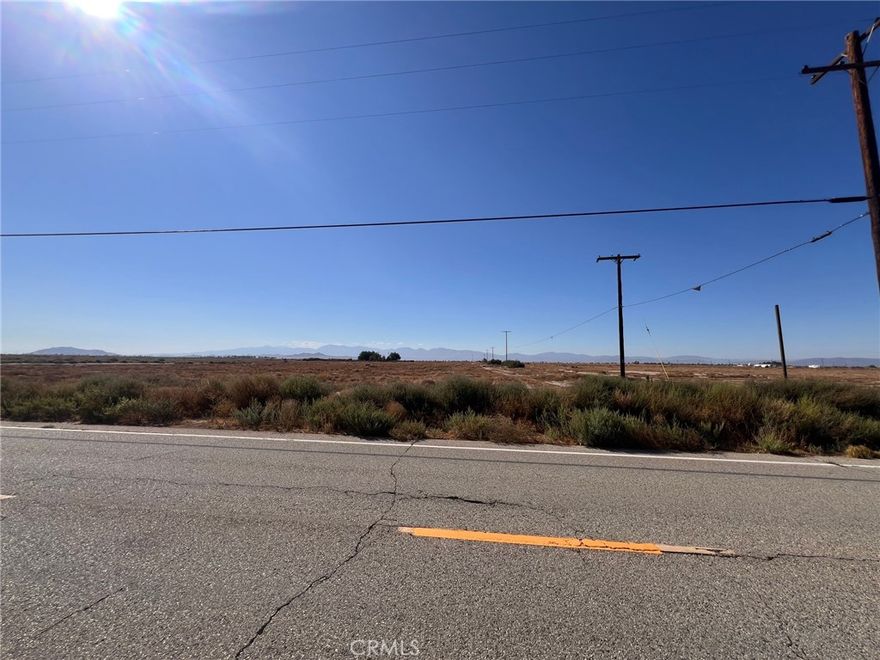 Welcome to 9.7 Acres of vacant land for your future Ranch or Warehouse or... @ South East corner of Avenue H & 105 St. in Lancaster 93535. Zoning for Rural/Agriculture. You can inquire to Planning Dept of Lancaster or L A County for Residential zoning.A house is built just across street in front of the Lot.