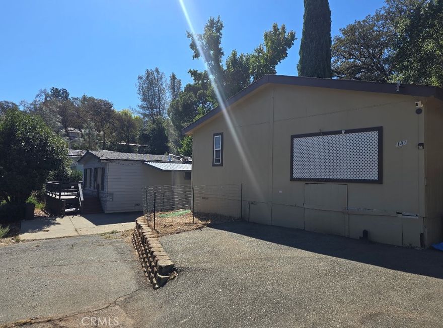 Welcome to this well-maintained 2-bedroom, 2-bath manufactured home located in the desirable Kelly Ridge neighborhood of Oroville. Built in 2003, this approx. 1,188 sq ft home sits on a generous 7,840 sq ft lot and offers comfort, space, and proximity to Lake Oroville.

Interior features include a spacious living room, formal dining area, and a bright kitchen with updated appliances. The primary suite includes a walk-in closet and private bath. A secondary bedroom and additional room provide flexible living space—ideal for an office, guest room, or hobby area.

Enjoy outdoor living with a shaded deck under mature oaks, and take advantage of the 8x10 storage shed and two off-street parking spaces. Recent updates include carpet, interior paint, and newer fixtures.

Central HVAC, and a peaceful community setting make this home a standout. Located minutes from Lake Oroville recreation areas, boat launches, and scenic trails.

Great as a full-time residence, vacation home, or rental investment. Don’t miss this opportunity!