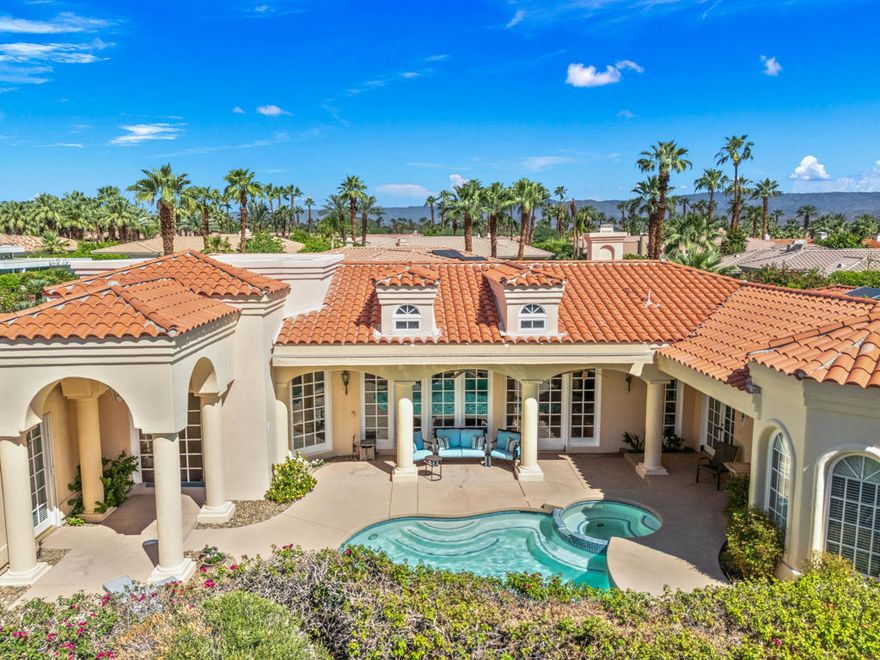 Custom built colonial style Mediterranean home with an Island flavor, and abundance of south and west facing views. French doors open to beautiful pool/spa, waterfall, and mountain views. Located on premium corner lot on quiet cul-de-sac within prestigious Painted Cove neighborhood at guard gated Indian Wells Country Club. Lovely, gated south facing Courtyard entry with gorgeous pool/spa, built-in BBQ, and covered patio. The mountain views and the sunsets are amazing! Home boasts 3678 Sq. Ft., 4 bedrooms, 3 baths, 2 fireplaces, Great Room, formal Dining Room, Gourmet Kitchen, oversized with A/C a 3 car plus golf cart garage. Gourmet Kitchen has granite countertops, kitchen island, and informal dining area. Great Room features awesome south views, built-in entertainment center with custom cabinetry, fireplace, and Wet Bar with granite counters, and bar refrigerator. Primary Bedroom is charming with marble fireplace, large sitting area, and French doors lead out to pool/spa. Primary Bath is spacious, large walk-in closet, double sinks, tiled counters and shower, and jet tub spa. Ensuite baths to the Guest Bedrooms. Large Laundry Room has big closet, deep tub sink, and lots of storage. Low HOA's.