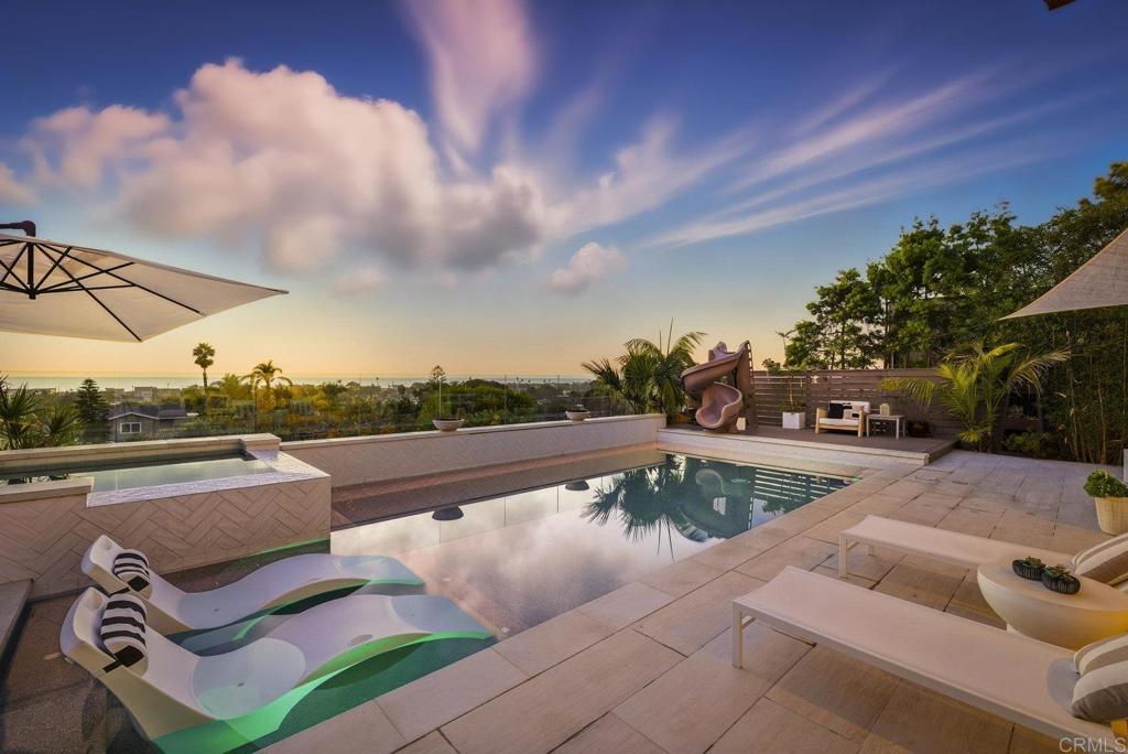 Come home to 870 Hymettus and experience coastal living at its finest! Located west of the 5 in the ultra chic community of Leucadia, this one of a kind masterpiece features 6 bedrooms, 4 1/2 bathrooms offering 4,109 of refined living space.  You will be left in awe by the stunning panoramic ocean views and breathtaking sunsets from both levels of the home.  Designed for the ultimate indoor-outdoor lifestyle, the home showcases expansive glass doors that open to covered patios, sparkling pool and hot tub and lush coastal landscaping creating a seamless flow for year round enjoyment. The gourmet chef’s kitchen impresses with top-tier appliances, custom cabinetry, and a spacious island perfect for entertaining or making your favorite meal for family.  Upstairs, you can escape the daily grind and unwind in the oversize resort like retreat that you can just slip from the hustle of the outside world.  Step outside to the inviting 2nd level view deck provides the perfect vantage point to take in the sea breeze and sparkling horizon.  Located close to the beaches, award winning schools, fine dining, shopping and everything that makes Leucadia funky.  870 Hymettus is not just a home it is a lifestyle!