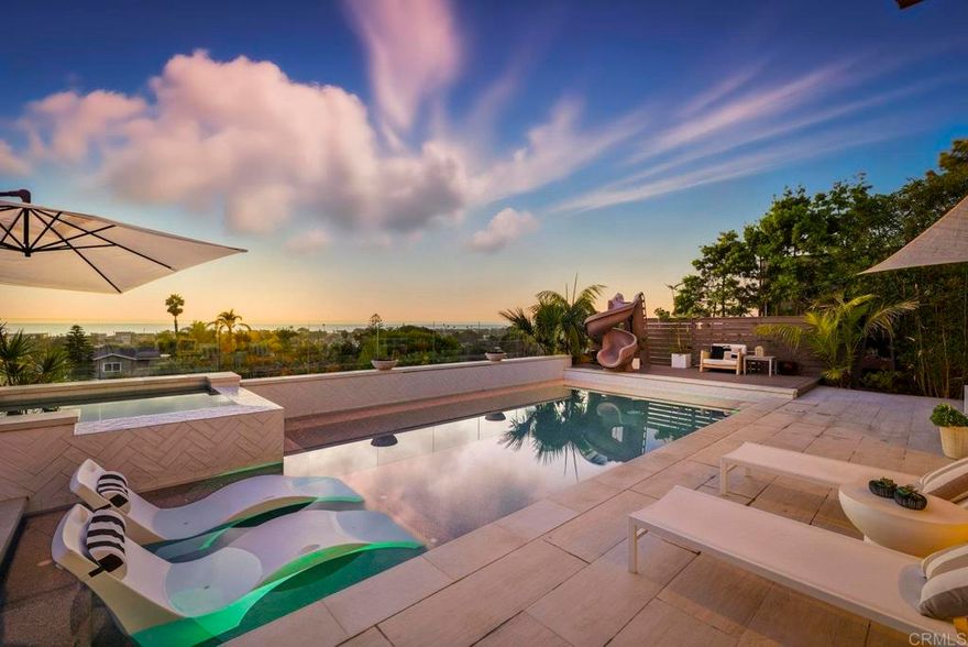 Come home to 870 Hymettus and experience coastal living at its finest! Located west of the 5 in the ultra chic community of Leucadia, this one of a kind masterpiece features 6 bedrooms, 4 1/2 bathrooms offering 4,109 of refined living space.  You will be left in awe by the stunning panoramic ocean views and breathtaking sunsets from both levels of the home.  Designed for the ultimate indoor-outdoor lifestyle, the home showcases expansive glass doors that open to covered patios, sparkling pool and hot tub and lush coastal landscaping creating a seamless flow for year round enjoyment. The gourmet chef’s kitchen impresses with top-tier appliances, custom cabinetry, and a spacious island perfect for entertaining or making your favorite meal for family.  Upstairs, you can escape the daily grind and unwind in the oversize resort like retreat that you can just slip from the hustle of the outside world.  Step outside to the inviting 2nd level view deck provides the perfect vantage point to take in the sea breeze and sparkling horizon.  Located close to the beaches, award winning schools, fine dining, shopping and everything that makes Leucadia funky.  870 Hymettus is not just a home it is a lifestyle!