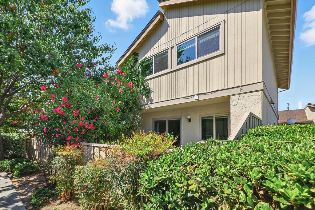Stylish and move-in ready, this 3-beds, 2.5-bath, 1,366 sq. ft. two-story townhome offers privacy, abundant natural light & a welcoming layout designed for comfort. Nestled in a quiet, well-kept community, it features a gated front courtyard and sunny back patio, ideal for gardening, or entertaining. Inside, the living room showcases a cozy fireplace & recessed lighting. The dining area flows into a bright kitchen with stainless steel appliances, ample cabinetry, a newer range hood, & a glass door that opens to the patio. A full-size washer & dryer conveniently located downstairs. Upstairs, three bedrooms include a primary suite with vaulted ceilings, walk-in closet & remodeled bath. The secondary bedrooms share an updated hall bath. Additional highlights include wood flooring throughout, dual-pane windows, and detached 2-car garage accessed from the courtyard. Recent upgrades add even more value with central A/C, water softener, and water heater. The community offers a sparkling gated pool. Within walking distance is a nearby plaza with Starbucks, Safeway, a fitness center, and more. Just minutes from Santana Row, Valley Fair, and major Silicon Valley employers such as Apple and Nvidia. Easy access to highways. Dont miss this perfect blend of comfort, style & convenience!