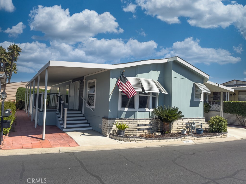 Welcome to Sunkist Gardens — Anaheim’s premier 55+ community where lifestyle, comfort, and convenience come together in perfect harmony.
This 2013-built manufactured home is more than just a place to live — it’s a retreat designed for ease, connection, and low-maintenance living in the heart of Orange County.
Step through the front door and you’re greeted by a bright, expansive great room with vaulted ceilings, wood laminate floors, and oversized windows that flood the space with natural light. The open-concept layout flows seamlessly from the living room to a generous kitchen — offering ample cabinetry, wraparound counters, a breakfast bar, and cozy nook that’s perfect for morning coffee or casual meals with friends.
Your primary suite feels like a personal spa — featuring dual sinks, a walk-in shower, separate soaking tub, and plenty of room to relax and unwind. A spacious second bedroom provides flexibility for visiting guests, hobbies, or a dedicated home office. The home also includes an indoor laundry room with extra storage, a two-car tandem covered carport, and a private storage shed.
But life at Sunkist Gardens is about more than what’s inside your home — it’s about the lifestyle just outside your door. Enjoy resort-style amenities including a sparkling pool, indoor spa, fitness center, clubhouse with community events, billiards room, library, and even a fenced dog park for your four-legged friends. And when you’re ready to explore, you’re just minutes from the Honda Center, Angel Stadium, Disneyland, Old Towne Orange, local hospitals, shopping, dining, and major freeways. Whether you’re downsizing, retiring, or simply seeking a more relaxed pace, this home offers a unique opportunity to enjoy it all — space, community, and location — without compromise.
Discover the lifestyle you’ve been waiting for. Welcome home to Sunkist Gardens.