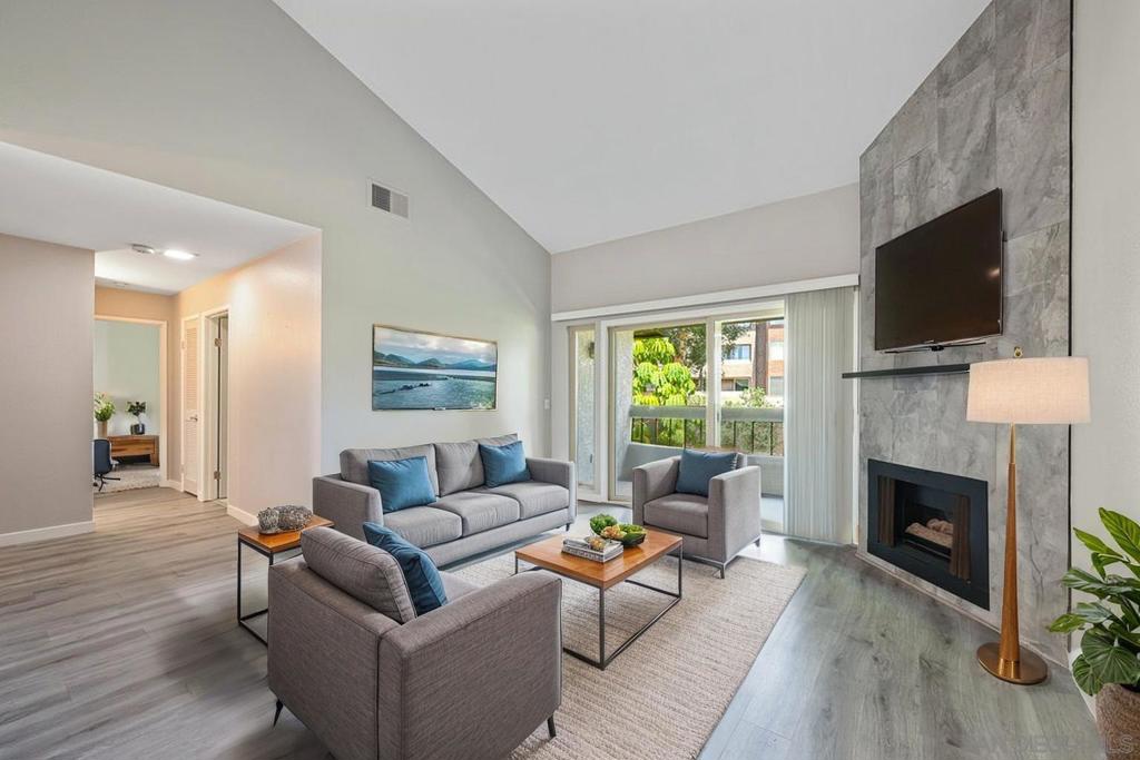 Location, Location, Location! Live your best life in this top-floor, 2 bed-2 bath move in ready Mission Valley condo, just mins from Snapdragon Stadium, SDSU, USD, Fashion & Mission Valley Malls, Old Town, downtown, the beach & more! Enjoy vaulted ceilings in the living room w/ a cozy fireplace, luxury vinyl flooring & spacious primary suite w/ ensuite bath & walk-in closet. The kitchen is upgraded w/ Corian Counters, Bosch & Samsung appliances. Amenities include a resort-style pool, spa, sauna, gym, & racquetball/tennis courts. Additional features: dual-pane windows, in-unit washer/dryer hookups, an assigned covered parking space with storage, plus additional first-come, first-served parking. VA & FHA Approved!