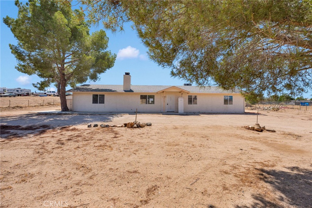 Welcome to this two-bedroom, two-bathroom home situated on a large generous lot in the city of Hesperia, California. This property offers a open spacious floor plan along with it's natural surroundings.. There is a fireplace in the living room. Two spacious bedrooms. An indoor laundry area in the garage. The kitchen sits adjacent to the living room area and offers ample counter top and cabinet space. The property boasts a blend of comfort and functionality, and natural lighting. Don't miss out and come take a look.