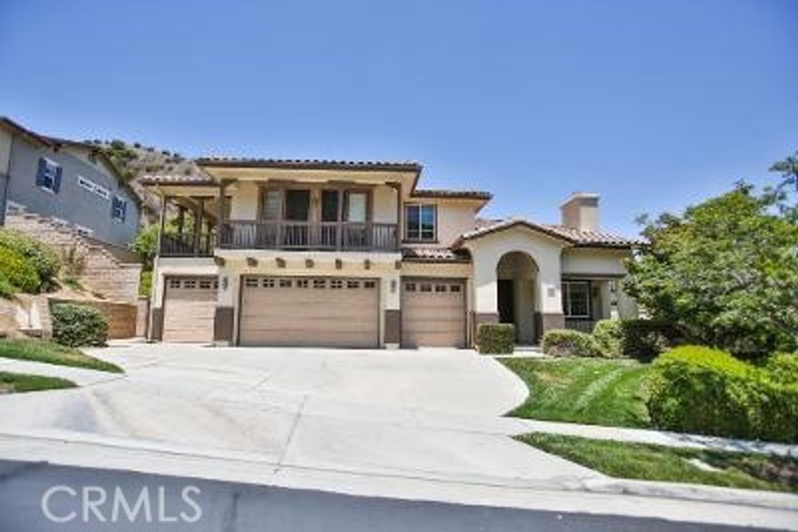 Luxurious resort-style beauty nestled in the majestic hills of Sierra Del Oro. Located on an exclusive and quiet cul-de-sac, this home rests among picturesque hillsides. A dream come true for entertainers with oversized front and rear balconies. This amazing home offers 4 bedrooms plus an office, 4 bathrooms, and one bedroom located downstairs. With 4073 sqft of living space and a 4-car garage, there's plenty of room for everyone. The beautiful living room has a high vaulted ceiling, a formal room, and a cozy family room with a fireplace. The spacious kitchen offers plenty of space, a walk-in pantry, a kitchen island, and granite countertops. The large kitchen opens to the family room, a breakfast nook area, and plenty of cabinets for storage. Downstairs also features one spacious room with a full bath and inside laundry. The upstairs den makes an ideal study or play area. The large master bedroom has neutral colors and amazing views from every angle. The master bathroom offers dual sinks, a huge walk-in closet, a shower, and a tub. There are 3 additional bedrooms upstairs with a hallway bathroom and carpet throughout. The spacious backyard is perfect for entertaining with magnificent city light views as a backdrop. Close by are great shopping, Green River golf course, schools, and nearby parks. Easy access to 91 FWY, 241 Toll Rd, 71 expressway, Metrolink station, and Foothill Pkwy.