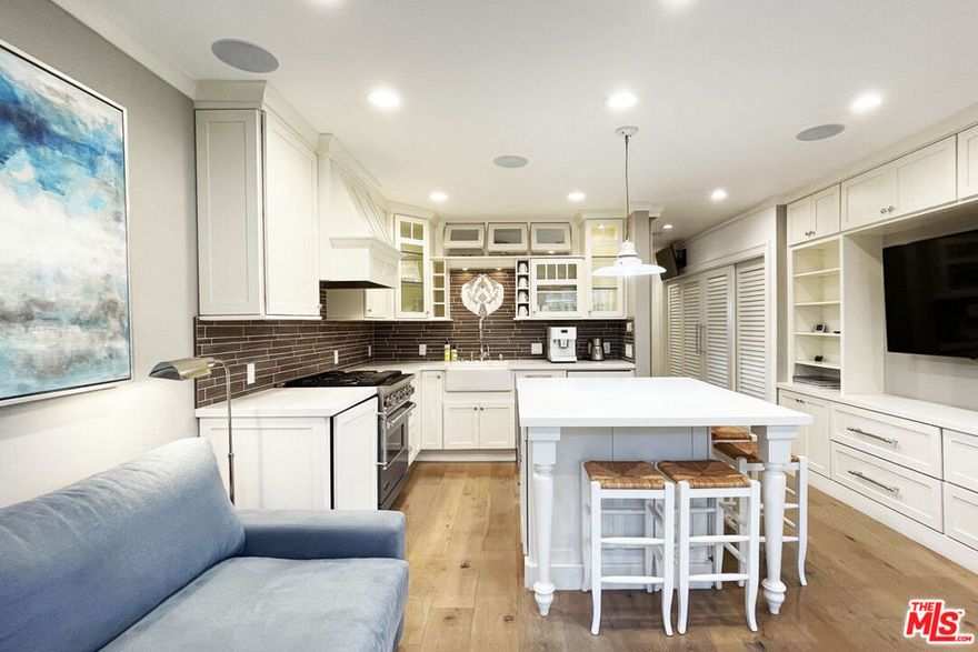 Drive down a palm lined Santa Monica street, breathe the ocean air, and arrive at a state of the art modern farmhouse chic haven built for effortless living. Inside, a beautifully defined sleeping area lives like a true bedroom, while premium touches -- a smart bidet, in-unit laundry tucked into a walk-in cedar closet, and a chef's kitchen with fully integrated appliances -- elevate the routine. Two panel-ready refrigerators, a built-in freezer, a concealed dishwasher, and a hidden pull-out disposal compartment disappear behind custom cabinetry for a seamless, furniture like finish. Sunlight pours through patio doors, connecting the open living and kitchen spaces to easy mornings and spontaneous nights out. Quietly positioned as the last residence at the back of the building, it offers both a welcoming front entrance and a discreet, direct to garage exit -- secure garage parking sits just steps from your door for quick in and out. A stone's throw from Montana Avenue and moments to the beach, this turnkey landing pad makes settling into Los Angeles feel instant. This is truly the best value in all of Santa Monica.