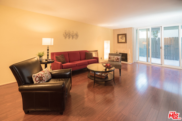 Wonderful up-dated two bedroom two bath condominium in a smaller building with open walkways between units giving an airy and open feeling. This unit has a large living room with fireplace, new flooring and opens to a huge private fenced-in patio great for dining Al fresco or just sitting back and relaxing with friends and your favorite beverage. This home also has an open kitchen with beautiful granite counters and Washer and Dryer. There is also a large master bedroom with lots of closet space and view of the patio. there is new flooring throughout the unit. The building is located just a half block form the trendy shops and eateries along Hillhurst south of Los Feliz Blvd.