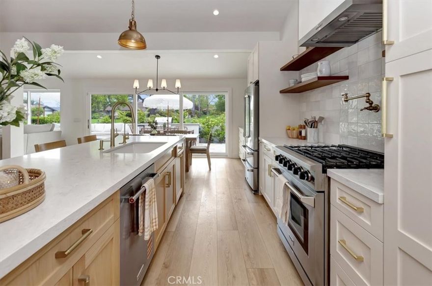 Step inside this beautifully reimagined single-level home featuring three spacious bedrooms, a versatile bonus room or home office, and two stunning modern bathrooms. Perfectly positioned along the greenbelt, this home enjoys wide-open views of lush greenery, creating a peaceful, nature-filled backdrop that can be enjoyed from nearly every window. 
This home was completely remodeled in 2024, including additions of smooth drywall and smooth stucco, architectural beams, all new electrical and plumbing, new HVAC system, recessed lighting throughout, dual-pane windows, a brand-new roof, a reverse osmosis water filtration system and a state-of- the art security system with cameras and full house sensors. Meticulously curated to blend design and function, the home is anchored by a breathtaking chef’s kitchen featuring brand new Thor and KitchenAid appliances, wine fridge, custom range hood, pot filler and a versatile bar or coffee station. No expense was spared! 
With no interior stairs and a seamless indoor-outdoor flow, this home feels like a bright and warm beach retreat—comfortable, cozy, and effortlessly inviting—offering the relaxed, vacation-like feel of an upscale Airbnb, right in the heart of Newport Beach. The spacious back patio is an effortless extension of the home’s light, airy vibe—complete with a built-in BBQ, built-in seating, an outdoor gas fireplace and cozy seating areas—is the perfect place to gather with friends, linger over dinner, and have your morning coffee. Known for its exceptional safety, miles of walkable paths, vibrant community pools, and close-knit community where neighbors look out for one another, Eastbluff offers the ideal blend of coastal convenience and peaceful living. With top-rated schools, the Back Bay Loop Trail, Fashion Island, and the world-class beaches just minutes away, this home embodies the very best of Newport Beach living—safe, scenic, and effortlessly sophisticated in one of Newport’s most desirable neighborhoods.
