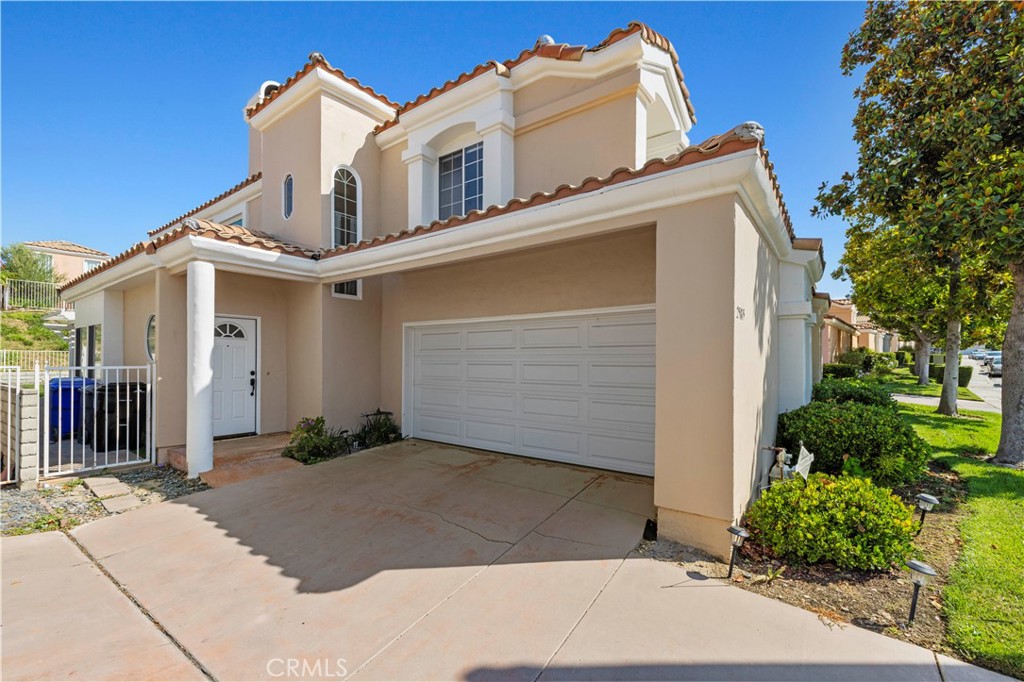 Located in the heart of Stevenson Ranch on a quiet cul-de-sac, this well-maintained home is just minutes from top-rated schools, the Stevenson Ranch Marketplace, restaurants, and offers easy freeway access. Featuring a bright and open floor plan, the home is in turnkey condition and ready for immediate move-in. The spacious living room includes a cozy fireplace, tile flooring, and plantation shutters. The kitchen is well-equipped with a built-in oven, microwave, stovetop, dishwasher, stainless steel sink, and sleek quartz countertops with a stylish tile backsplash. The home features two primary bedrooms upstairs and a third bedroom conveniently located on the main level. The upstairs laundry room adds extra convenience. Enjoy the spacious backyard, complete with a patio deck, low-maintenance artificial grass, and paver stones—perfect for outdoor entertaining.