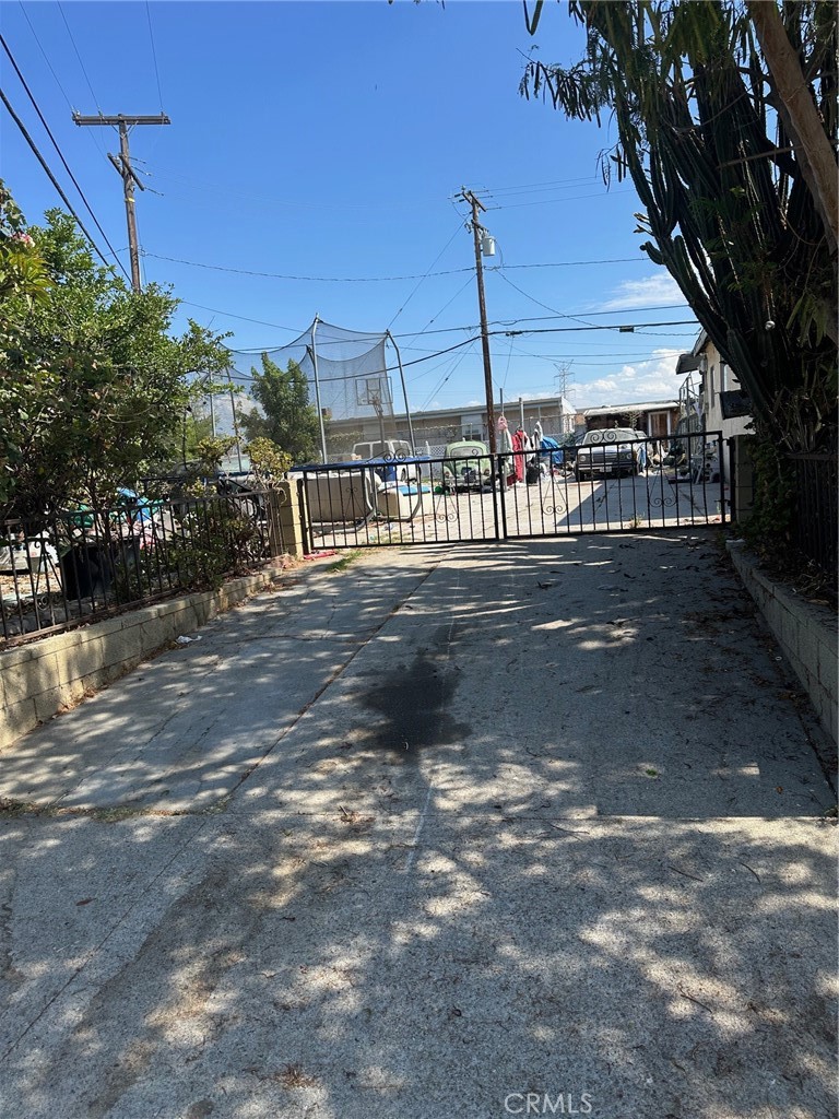 Ideal location! conveniently situated one block from Paramount and Beverly Blvd, this property showcases considerable potential with a lot over 10,000 square feet!