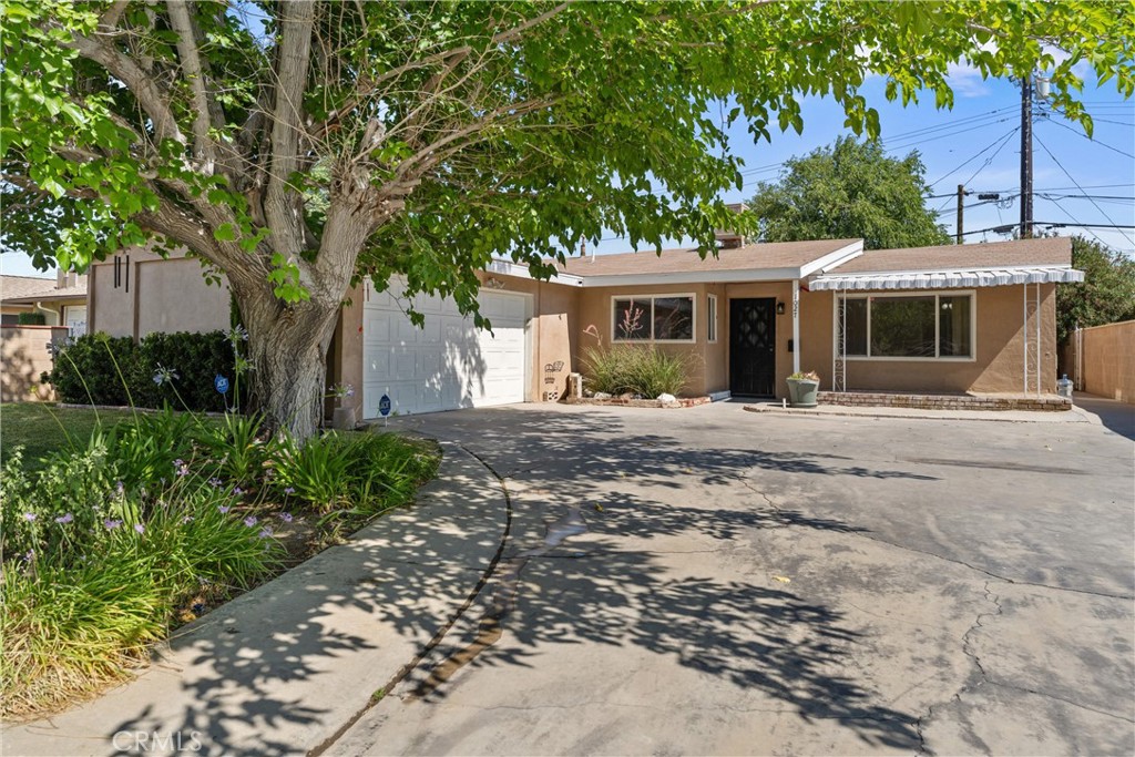 This home qualifies for a special loan program with a low down payment and NO PMI! West Lancaster - Move In Ready! 3 Bedroom and 3 Bathrooms with an office or 4th Bedroom. Living Room , Plus den with wood burning stove. Enjoy the mature landscape with tree lined streets. Quiet backyard with shade trees and block walls. Home is centrally located near restaurants, shopping and easy access to the freeway.