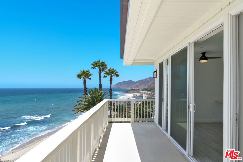 Brand new 2025 construction - Welcome to the Malibu Bay Club located on an oceanfront bluff offering an incredibly serene beach lifestyle. Known for its cove beaches and natural beauty, this property is an ocean lover's paradise, mere steps from the sand. Ebb Tide Lane is a penthouse corner unit offering endless ocean and coastline views. Argueably one of the best locations in the entire complex. Completely rebuilt from the ground up in 2024/2025 and drenched in natural light, this top floor unit features an open floor plan with high ceilings, large open kitchen, breakfast and dining area, living room with fireplace, skylights, walls of glass and sliding doors that open to an expansive deck. This unit is drenched in natural light and feels very private plus being at the end of the street plus you are right over the sandy beach below. Enjoy unobstructed coastline views of county line beach to the Channel Islands and located next to two of the local's favorite surf breaks! Private laundry, A/C, ceiling fans, solar panels, beautiful fixtures and finishes throughout. 1 car carport plus 2 additional uncovered parking spaces which is unique to this unit and a few others. Don't miss this rare opportunity to own this premier penthouse corner unit in time for summer. The Malibu Bay Club is one of only a few beachfront complexes in Malibu. Gated with secured entry, beautiful pool area with spa and direct beach access to sandy coves. The community recently completed renovations to all the condo exteriors including new roofs, copper gutters, new exterior paint, tile and more.