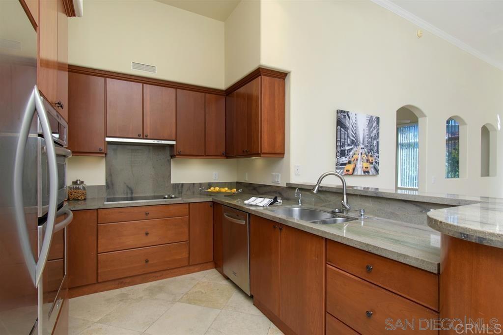 One of a kind! Top level Sapphire unit with upgraded kitchen at The Regents La Jolla! Fully gated community and garage. High volume ceilings featuring a spacious living room, primary bedroom with dual sinks, two secondary bedrooms and a second bathroom located on opposite end of unit for some privacy. Ceiling fans in all bedrooms. Walk-in closets for bedrooms. Outdoor balcony with full sized washer and dryer closet (side by side). Open views of Marriott Hotel and office plaza. Located nearby elevator with direct access to parking garage. Two assigned side by side parking spaces in the underground and gated garage. Central A/C and heating in unit. Stainless steel appliances and unit comes with washer, dryer, and refrigerator. Community amenities include swimming pools/spas, two fitness rooms, yoga studio, movie room, sports club, large kitchen for events, front desk concierge, and clubhouse! Close access to highways and shopping (UTC Westfield Mall, I-5, I-805, I-52, I-56, Whole Foods, Vons, Trader Joe's, Nordstrom Rack, banking, restaurants, etc.).