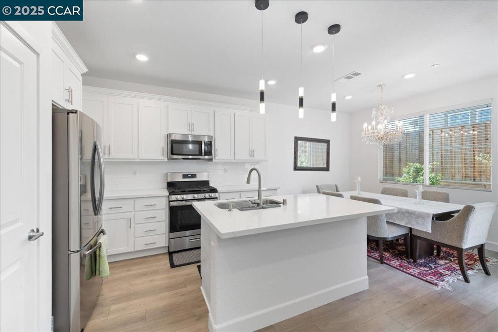 Welcome to 300 Hideaway Lane, a beautifully maintained 4BD/3BA home in a quiet Pittsburg neighborhood with an open, light-filled floor plan and a gourmet kitchen featuring granite counters and a large island. The spacious primary suite offers a walk-in closet and spa-like bath. Enjoy a fully cemented, upgraded backyard on a premium corner lot, providing privacy and low maintenance, perfect for gatherings or quiet evenings. Home includes leased solar, central HVAC, and a two-car garage. Conveniently located within walking distance to the Shops at San Marcos plaza, Sprouts, Safeway, coffee shops, dining, and parks, with easy BART and freeway access. A must-see!