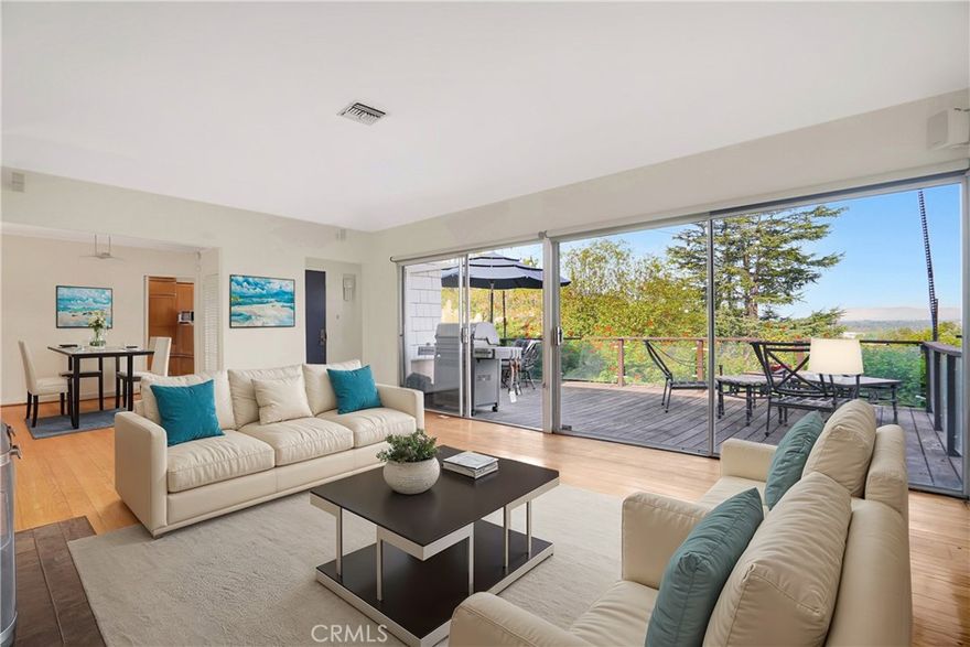 SPECTACULAR PANORAMIC VIEW, in the Studio City Hills, of the entire Valley enjoyed from BOTH a modern, private, fully furnished DECK as well as a wrap-around glass-enclosed living room. The Deck is oversized with a Bar B Que and two eleven-foot umbrellas. Single Level, South of the Boulevard, 5-minute walk to the heart of Studio City with a JACUZZI and outside shower!  2 Bedrooms, Den/Office, 2 baths (master bath recently renovated), Formal Dining Room, Fireplace, Hardwood Floors throughout, Modern Granite Kitchen with SUBZERO Refrigerator and WOLF Stove and state-of-the-art Water Filter.  ALL rooms open to the Fabulous Deck or to the Private Patio.  220v EV Charging outlet in the garage, smart thermostat.  Newer Roof (2023).  AND – up the hill from Laurel Tavern, Heavy Handed, and the Black Market Liquor Bar and down the street from the Shops @ Sportsman’s Lodge.