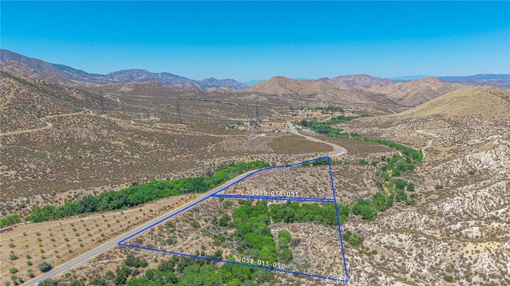 A rare opportunity to own two contiguous parcels nestled alongside the scenic Angeles National Forest. These properties feature a seasonal creek that meanders through the land, offering a tranquil natural setting. Both parcels are being sold together. Buyer to independently verify all information, including zoning, utilities, and build potential.