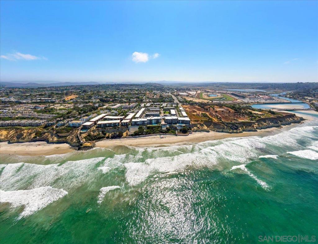 Presenting The Largest -Most Unique & Impressive Property Of The DMBC! Two (Former) Units Transformed Into This Unparalleled Contemporary Masterpiece With A Rustic Edge. A Literal Hop-Skip-And-A-Jump From The Private DMBC Beach Entrance, Racetrack, Cedros District & A Multitude of Shops & Restaurants. Beyond The 4-Car Attached Carport & Private Portico Are Copious Distinctive Touches Beyond Your Wildest Imagination! The Rustic Brick Accent Wall Encompasses The Eat-In Kitchen (Offering High-End Appliances, Imported Countertops, Bar Area, Walk-In Pantry Plus All The Bells & Whistles You Would Expect From A Home Of This Caliber) And Spacious & Inviting Living Area. The Extensive Wall Of Glass Doors Invite The Sunlight From The Secluded & Tranquil Lanai; Featuring Built-In BBQ, Beverage Fridge, Dining & Seating Areas & Lush Greenery. Frameless Glass Stair Railing Features Polished Steel Handrail, Footings & Risers. The Innovative Crestron Home Automation System Features Zoned Controls & Surround Sound For Every Room (Via iPads). The Privately Situated Master Suite Offers West Facing View Balcony, Seating & Desk Areas, Extensive Walk-In Closet & Grandiose Spa-Like Bathroom Including Steam Shower, Dual Toilets & Oval Soaking Tub. Each Notably Spacious Bedroom Offers An En-Suite Bath (Featuring Luxury Ann Sacks Tile), Flat Screen TV, Custom Wood Doors W/Privacy Glass & Custom Closet. Adjacent To The Downstairs Bedroom Sits An Opt 5th BR/Loft That May Serve As A 2nd Family Room, Guest Area Or Home Office. Short Term Rentals Allowed! Presenting The Largest -Most Unique & Impressive Property Of The Del Mar Beach Club! Two (Former) Units Were Transformed Into This Unparalleled Contemporary Masterpiece By Top Architectural And Interior Design Teams In 2008; Creating A Functional & Flowing Floorplan, Incorporating Brand New Systems And Finished Off With Top-Of-The-Line Features With A Rustic Edge And Super Cool Vibe Throughout. A Literal Hop-Skip-And-A-Jump From The Private DMBC Beach Access Steps, Del Mar Racetrack / Fairgrounds, Dog Beach, Cedros District And A Multitude of Shops & Restaurants, Relaxed Coastal Living Does Not Get Better Than This! Beyond The Large 4-Car Attached Carport Lined With Tropical Greenery, 2 Large Storage Closets & Private Portico Are Copious Distinctive Touches Beyond Your Wildest Imagination. The Rustic Brick Accent Wall Encompasses The Spacious & Inviting Living Room And The West-Facing Eat-In Kitchen Which Offers High-End Appliances, Imported Countertops, High-Gloss Wood Grain Cabinetry, Bar Area, Walk-In Pantry, Full Sized Wine Fridge, Veggie Sink & Beverage Center - Plus All The Bells & Whistles You Would Expect From A Home Of This Caliber. The Extensive Wall Of Glass Doors Invite Oodles Of Dancing Sunlight From The Secluded & Tranquil Lanai; Featuring Built-In BBQ, Beverage Fridge, Dining & Seating Areas And Lush Greenery Creating The Utmost Privacy. The Contemporary Frameless Glass Stair Railing Features Polished Steel Handrail, Footings & Risers And Leads To The Upstairs Laundry Room Offering Tons Of Storage Cabinets, New Full Sized Washer & Dryer, Wine Fridge And Farmer's Sink. The Privately Situated Master Suite Offers West Facing View Balcony, Desk & Seating Areas And Extensive Walk-In Closet With Stunning Built-Ins. The Grandiose Spa-Like Master Bathroom Includes Oodles Of Natural Light, Luxurious Steam Shower, Dual Vanities, Private Dual Toilet Areas And Oval Soaking Tub. Each Notably Spacious Secondary Bedroom Offers An En-Suite Bath (Featuring Unique Luxury Ann Sacks Tile Patterns), Wall-Mounted Flat Screen TV, Custom Wood Entry Doors With Privacy Glass Insets & Capacious Custom Closet Built-Ins. Adjacent To The Downstairs Bedroom Sits An Optional 5th Bedroom / Loft That May Serve As A Second Family Room, Guest Area Or Home Office. This One-Of-A-Kind Home Is Guaranteed To Impress The Most Discerning Buyer; Whether You Are Searching For A Unique & Low Maintenance Beach Proper...