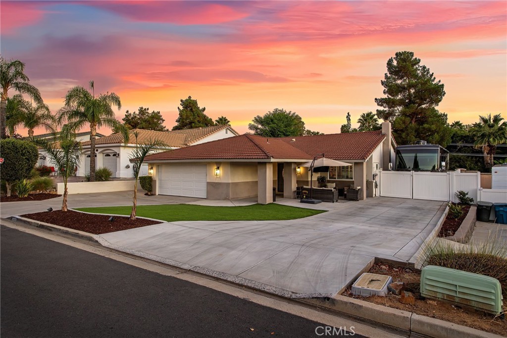 Welcome to this beautifully updated and move-in-ready solar powered home located in the heart of Canyon Lake, just a short stroll to the golf course. This 3-bedroom, 2-bathroom gem offers an inviting open-concept layout that’s perfect for both everyday living and entertaining. Step into a spacious living area with a grand stone fireplace, custom plantation shutters, and surround sound in both the living room and primary bedroom, creating a cozy and cinematic atmosphere. The kitchen and bathrooms have been thoughtfully remodeled with modern finishes, including brand new fixtures, updated flooring, and fresh paint throughout. The home features a brand-new AC unit, so you’ll stay cool all year round. Plus, with 32 paid-off solar panels, you’ll enjoy no electric bills! The attention to detail extends to the garage, which is fully finished with custom cabinetry and epoxy flooring—perfect for all your storage needs. Outside, the low-maintenance front yard features artificial turf, and the spacious backyard is beautifully landscaped with lush, green grass. The front patio provides the ideal space for relaxing or entertaining, complete with a TV mount for outdoor viewing. Need extra space for your toys? The 14x105-foot RV parking area with a 50-amp hookup ensures you’ve got room for it all.All of this located within Canyon Lake, a private, gated community with 24/7 security and unmatched amenities, including a 384-acre waterski/fishing lake, 20+ parks with beaches and playgrounds, basketball and baseball courts, tennis and pickleball, an equestrian center, an 18-hole golf course, dog park, community pool, restaurants, slalom course, ski jump, golf cart-friendly streets, and year-round events for the whole family!