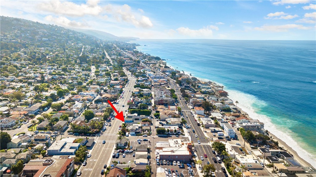 Charming Coastal Cottage in the Heart of Laguna Beach Village – Zoned for Live/Work Flexibility/Current Short Term Rental. Surfers dream location, one minute walk to local surf break.
Welcome to 1029 Glenneyre, a rare opportunity to own a beautifully updated single-level cottage just steps from everything Laguna Beach has to offer. Tucked behind a gated entry in the heart of the Village, this 2-bedroom, 1-bath home perfectly balances timeless charm with today’s modern upgrades—offering the ideal setting for both relaxed coastal living and professional use.
Step inside to find vaulted, beamed ceilings, rich hardwood flooring, and natural light throughout. The living and dining areas are warm and inviting, complete with custom built-ins and period details that nod to the home's historic roots. The remodeled kitchen is a chef’s dream, featuring Sub-Zero refrigeration, custom cabinetry, generous counter space, and a dedicated laundry area with access to a private large two-car driveway.
Each bedroom is thoughtfully placed on opposite sides of the home for privacy, and the upgraded bathroom features designer finishes and fixtures. The newly installed central air conditioning keeps the interior cool and comfortable year-round. Downstairs, a spacious basement offers ample storage or potential workshop space. Hot outdoor shower.
Zoned for professional business use, short term rental license zoned as well, this home is ideal for buyers seeking a unique live/work opportunity in one of Southern California’s most iconic beach towns. Leave the car at home and enjoy walkable access to top-rated restaurants, local cafés, galleries, boutiques, and world-famous beaches—all just minutes from your front door.
Whether you're an entrepreneur, artist, or simply looking for a stylish, centrally located coastal residence, this Laguna Beach gem checks all the boxes.
