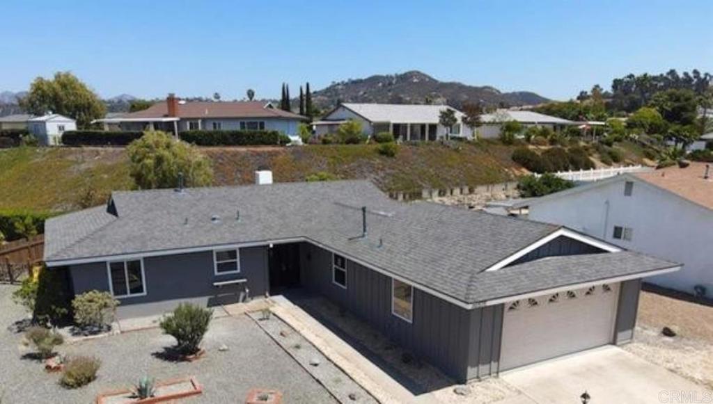 Step into this stylishly modernized single-level home with no stairs, located in the welcoming neighborhood of Seven Oaks, a 55+ community in Rancho Bernardo. Inside, the home has been thoughtfully improved with a substantial investment in updates and upgrades. The heart of the home shines with an open feel thanks to a professionally engineered wall removal between the living and dining areas, creating seamless flow. The luxury vinyl plank flooring, new bedroom carpeting, and fresh interior paint lend a modern and inviting feel throughout. Plantation shutters, updated ceiling fans, and a stylish new shower door in the primary bath add both charm and function. In addition to two comfortable bedrooms, this home also includes a flex room—ideal as a home office, guest space, hobby room, or den—giving you the versatility to tailor it to your lifestyle needs. The kitchen features a new dishwasher along with a pantry thoughtfully added by the current owners for extra storage, blending modern convenience with practical upgrades. The home’s comfort has also been enhanced with attic insulation and air duct cleaning for improved energy efficiency. Outdoors, the property has been transformed with refreshed landscaping, turf installation, a recoated patio, fencing, and a new backyard retaining wall, creating a private and low-maintenance setting perfect for enjoying San Diego’s year-round sunshine. Residents of Seven Oaks enjoy access to a vibrant community center with pool, spa, fitness room, library, pickleball, shuffleboard, and an active calendar of clubs and social events—plus mature tree-lined streets, walkable paths, and convenient proximity to shopping, dining, golf, and medical facilities. Move-in ready and situated in a neighborhood designed for connection, relaxation, and active living, this home offers a wonderful blend of lifestyle and value. -Professional Photos Available Soon!