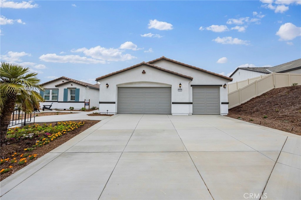**NEW CONSTRUCTION**This is far more than a four-car garage; it is a sanctuary where the love for four cars is transformed into a passion. "There is Simply Nothing Like It” Countryside Estates friendly environment with scenic views and Open spaces. Nestled on a sprawling 20,000 sq. ft. homesite. Step into luxury with The Serenity floorplan at Countryside Estates, perfectly situated in the vibrant community of Jurupa Hills. With the Spacious layout this floorplan possesses an expansive, seamless open concept for indoor, with possibilities of outdoor living and entertainment. This remarkable property boasts an expansive backyard, perfect for hosting memorable gatherings, or simply relishing tranquil moments with family and friends.
The gourmet kitchen, equipped with cutting-edge appliances, elegant Cashmere Thermofoil Cabinetry, spacious designer quartz countertops, and significant storage, serves as a perfect haven for culinary enthusiasts and social gatherings. Experience sophistication underfoot with designer vinyl plank flooring, elegant 12x24 tile, and plush carpeting thoughtfully integrated throughout the home. Envision building family traditions or creating treasured memories in this refined and practical space.
The opulent primary suite boasts a sliding door that opens to the backyard, to begin your day with a peaceful cup of coffee, immersed in the enchanting allure of serene mornings. This home is enveloped in the refreshing embrace of country air. The suite is complemented by a luxurious en-suite bathroom, thoughtfully designed with dual walk-in closets framed by elegant double doors and featuring two sinks, seamlessly blending practicality with sophistication.
Energy Efficiency: Designed with eco-friendly materials and enhanced by state-of-the-art energy-saving features.
Seamlessly connected to major freeways for an effortless commute.
Experience the ultimate fusion of elegance, comfort, and convenience at The Serenity Model. Book a viewing today and discover what sets this home apart.