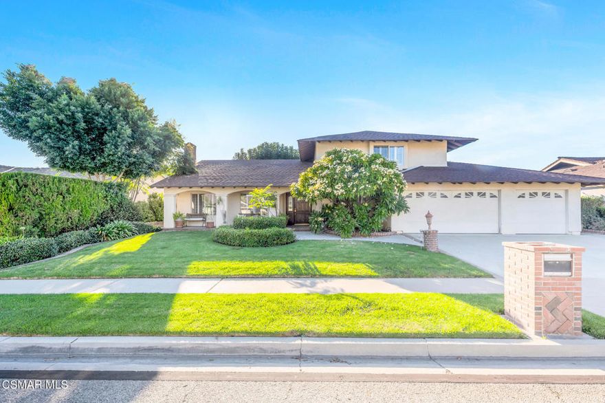 Beautifully maintained and rich with character, this 5-bedroom, 3-bath Fountainwood home offers approximately 2,535 sq. ft. of living space on an 8,712 sq. ft. lot with a 3-car garage. Blending comfort, style, and functionality, it's ideally situated in one of North Central Simi Valley's most established neighborhoods. Curb appeal shines with a brick-lined driveway and walkway, lush green landscaping, and a full covered front porch with a sitting area--perfect for morning coffee or evening relaxation. Inside, you'll find bright, inviting interiors with neutral-toned walls, plantation shutters, and recessed lighting in many rooms. The tri-level floor plan flows seamlessly from a sunken living room with a stacked-stone fireplace to an elegant dining room highlighted by a chandelier and natural light. The home offers two downstairs bedrooms, including one that is currently set up as a home office with glass French doors, built-ins, and dual entry points--providing flexibility for guests, extended family, or work-from-home needs. The thoughtfully designed and updated kitchen showcases white cabinetry, granite-tiled counters, and a generous island with a gas cooktop and grill, convenient storage niches, and sitting space at one end. Display-glass cabinets, double ovens, a built-in refrigerator, recessed lighting, tile flooring, and a built-in wine rack with adjoining breakfast area make this kitchen a centerpiece for gatherings. A few steps down from the kitchen, the spacious family room offers a second fireplace, built-ins, a wet bar, and a large sliding door leading to the backyard. This lower level also features a bathroom with a shower and a laundry room with garage access for added convenience. Upstairs, two secondary bedrooms share an updated hall bath with built-ins and decorative tile finishes, while the private primary suite features a walk-in closet and a luxurious en suite bath with a corner soaking tub, decorative tile surround, and a curved glass-enclosed shower with a Kohler body-spa system. The home is equipped with a dual air-conditioning system--one unit for the lower level and another for upstairs--with separate zones for the primary suite and the two secondary bedrooms, providing efficient and customizable comfort throughout. The private, lush backyard feels like an outdoor sanctuary--complete with mature shade trees, two brick patio areas (one beneath a shade tree and another fully covered with a ceiling fan and brick columns), a flower-filled fountain, raised brick planters, roses, and fruit trees. With its open layout and relaxing ambiance, this space is ideal for entertaining or peaceful outdoor enjoyment. Ideally located in the highly regarded Fountainwood neighborhood, this home is conveniently near local elementary and middle schools, community parks, recreation, shopping, and dining--capturing the best of North Central Simi Valley living with a welcoming sense of home and community.