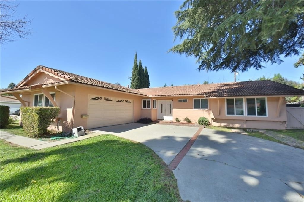 Discover this beautifully maintained single-level home nestled in the sought-after community of Diamond Bar. Situated on a generous 10,792-square-foot lot, this residence offers a harmonious blend of comfort, modern upgrades, and convenience.
Featuring 3 spacious bedrooms and 2 updated bathrooms, the home welcomes you through an elegant door entry. The well-designed floor plan provides an effortless flow from the living room to the dining area, opening into a contemporary kitchen equipped with a stylish quartz island—perfect for both everyday cooking and entertaining guests.
The cozy family room, complete with a fireplace, creates a warm and inviting space for relaxation. The kitchen showcases an upgraded backsplash for a refined touch, while recessed lighting and dual-pane windows enhance natural light and energy efficiency throughout the home.
New vinyl flooring adds durability and charm, complemented by fresh paint inside and out. The remodeled master bathroom boasts sleek tile walls and flooring, delivering a spa-like experience.
Additional highlights include an epoxy-coated garage floor for durability and style, and a versatile bonus room ideal for a home office, playroom, or media space.
Conveniently located near shopping centers, supermarkets, restaurants, and major freeways (57 & 60), this property offers easy access to everything you need.
This move-in-ready gem is a rare find in Diamond Bar—don’t miss your chance to call it home!