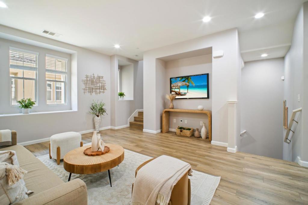 Welcome home to this sleek, move-in-ready 3-bed, 2.5-bath townhome in the highly sought-after Siena at Parkside community, within the desirable Cannery Park area. This residence boasts a fantastic layout, featuring brand new hardwood-style vinyl flooring throughout the main areas and a freshly painted interior, creating a bright and inviting atmosphere. A versatile entry-level bonus room offers a separate space ideal for a home office, gym, or kids' play area, providing flexibility to fit your lifestyle. The gourmet kitchen is a true standout, with an oversized breakfast bar, black and stainless steel appliances, granite countertops, a large island, and a spacious walk-in pantry. Enjoy efficient AC, impressively low energy bills and a dedicated 2-car garage with a Level 2 EV wall charger. The HOA covers exterior maintenance and water, providing convenient, low-maintenance living. Commuters will love the prime location with easy access to I-880, the San Mateo-Hayward Bridge, BART, and Amtrak, simplifying trips across the Bay Area. Plus, you're also just minutes away from essential shopping centers and services, including the post office and Business Costco.This turn-key home is an ideal opportunity, especially for first-time homebuyers. Don't miss your chance to make it yours!