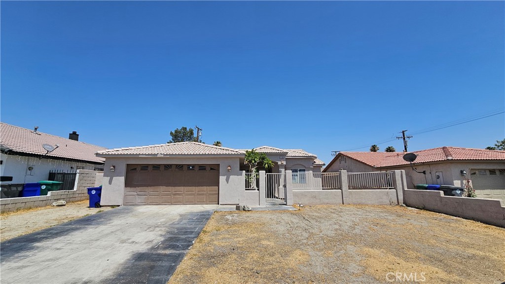 This single family residence is located in a great neighborhood on the north end of Cathedral City. It is near the downtown shopping center and the Palm Springs airport. This home consists of 4 nice sized bedrooms and 2 full bathrooms. The kitchen has recently been upgraded, with newer cabinets & granite countertops. The kitchen is large and open, it over looks the dining area as well as the spacious living room. You have a large master bedroom, a large walk in closet. Plus, a sliding door access to the backyard. The other 3 bedrooms are roomy and the full interior has been painted. There is a 2 car garage with laundry hookups. This property has central heating & cooling, a tile roof and a gated front entrance for additional privacy. The backyard has plenty of room to transform it into a desert paradise. With a huge covered patio and enough room for a pool. Come check it out.